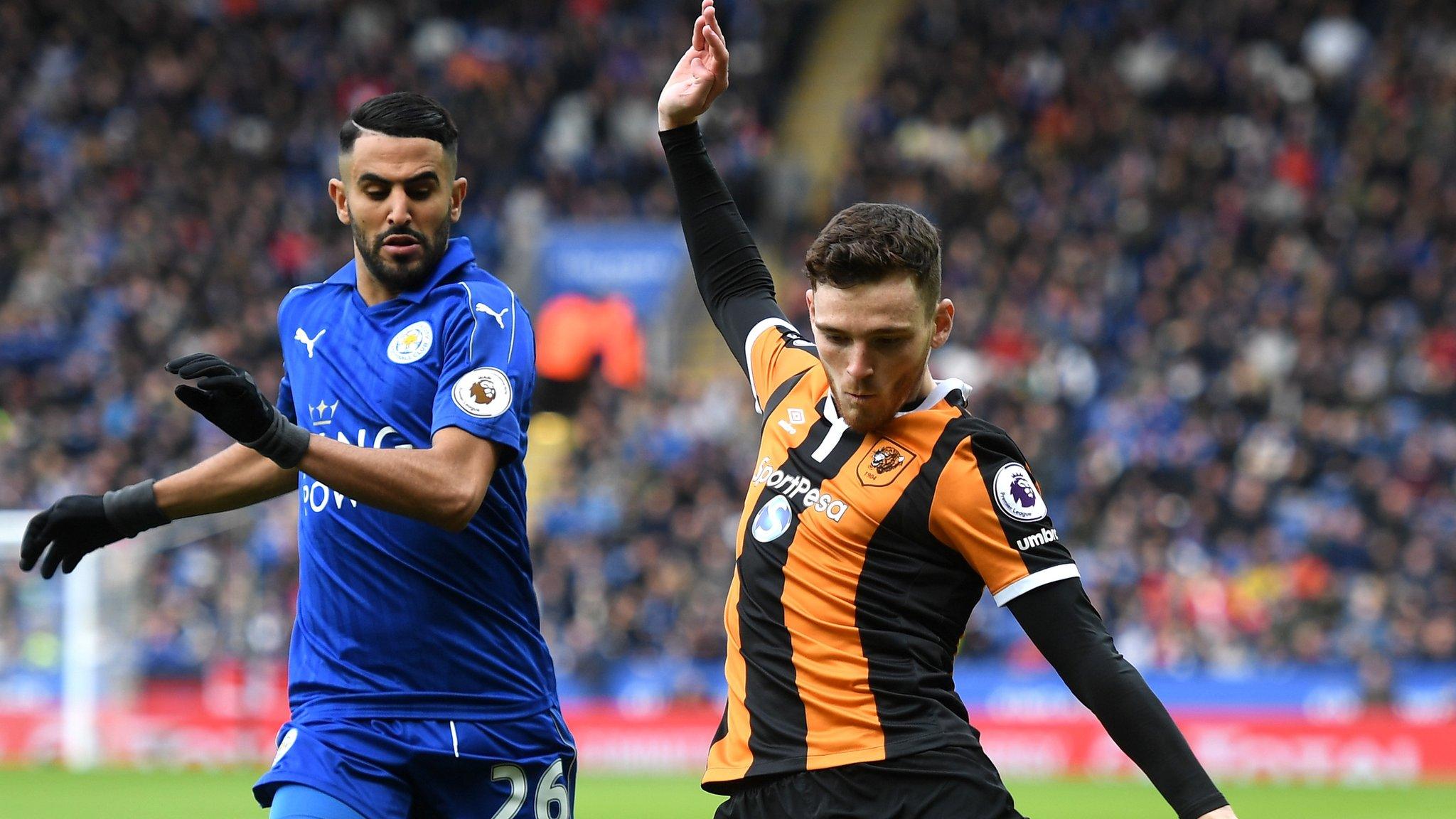 Ryiad Mahrez challenges for the ball