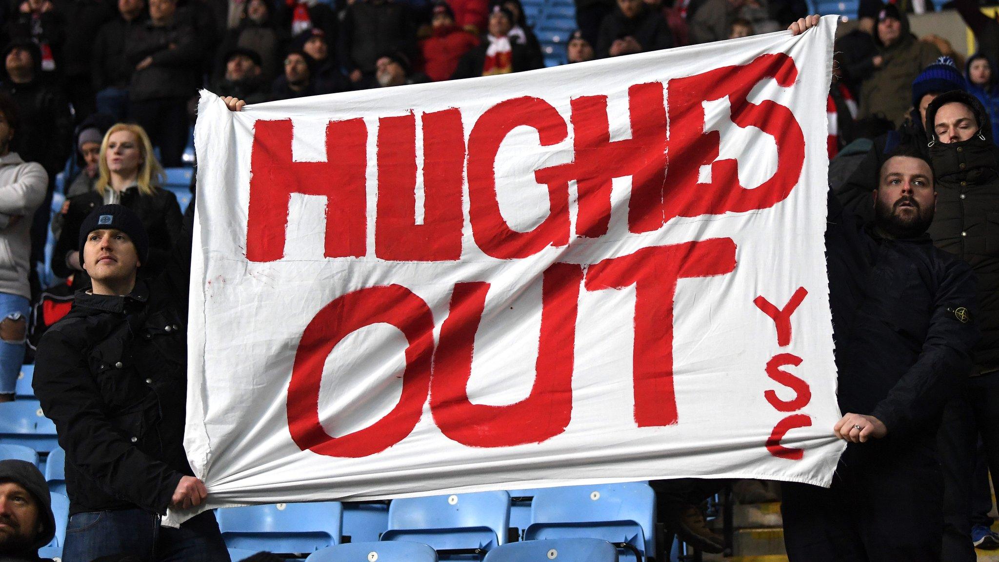 Stoke fans hold aloft a banner at Coventry