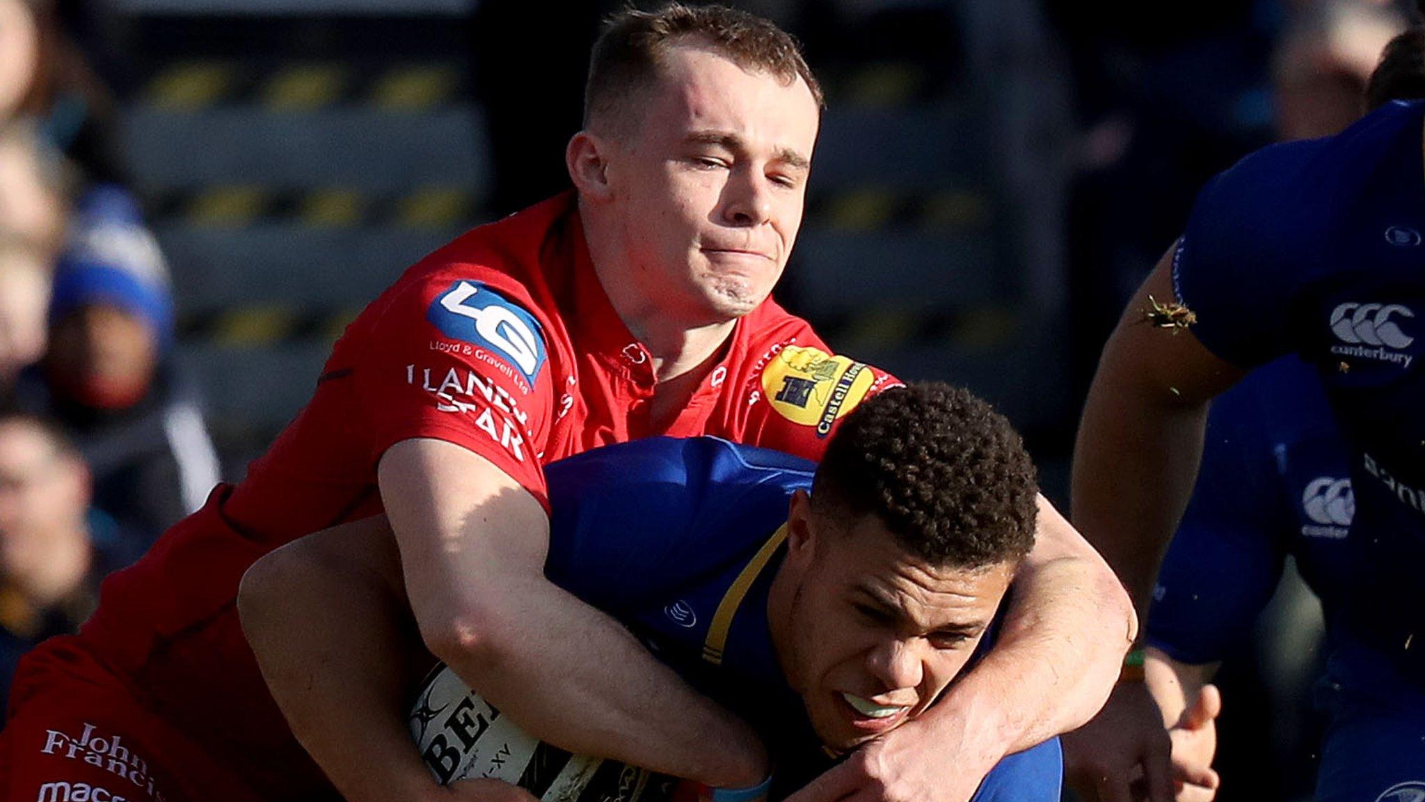 Ioan Nicholas of the Scarlets and Leinster's Adam Byrne