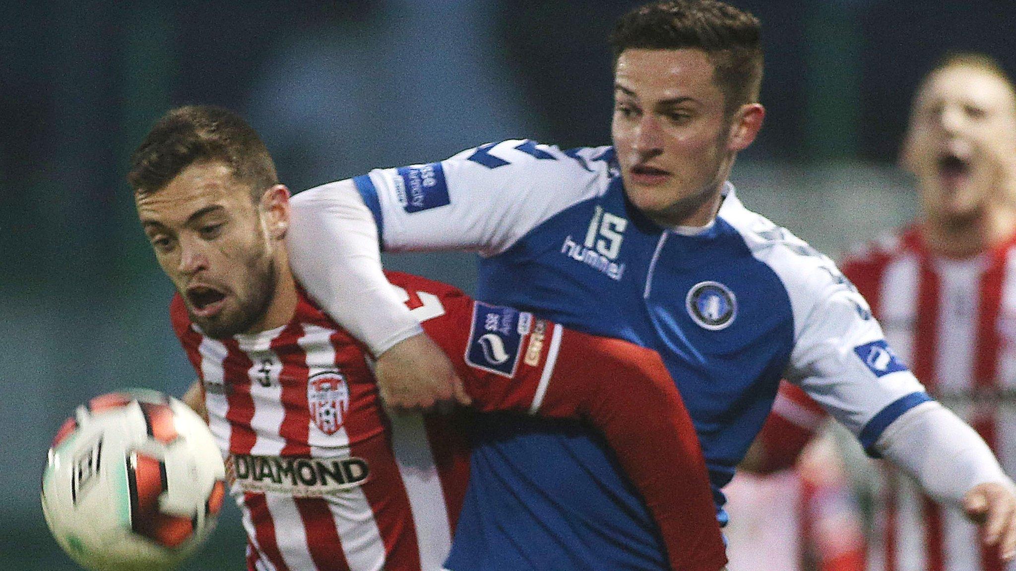 Derry's Nathan Boyle tussles with Limerick opponent Tommy Whitehead