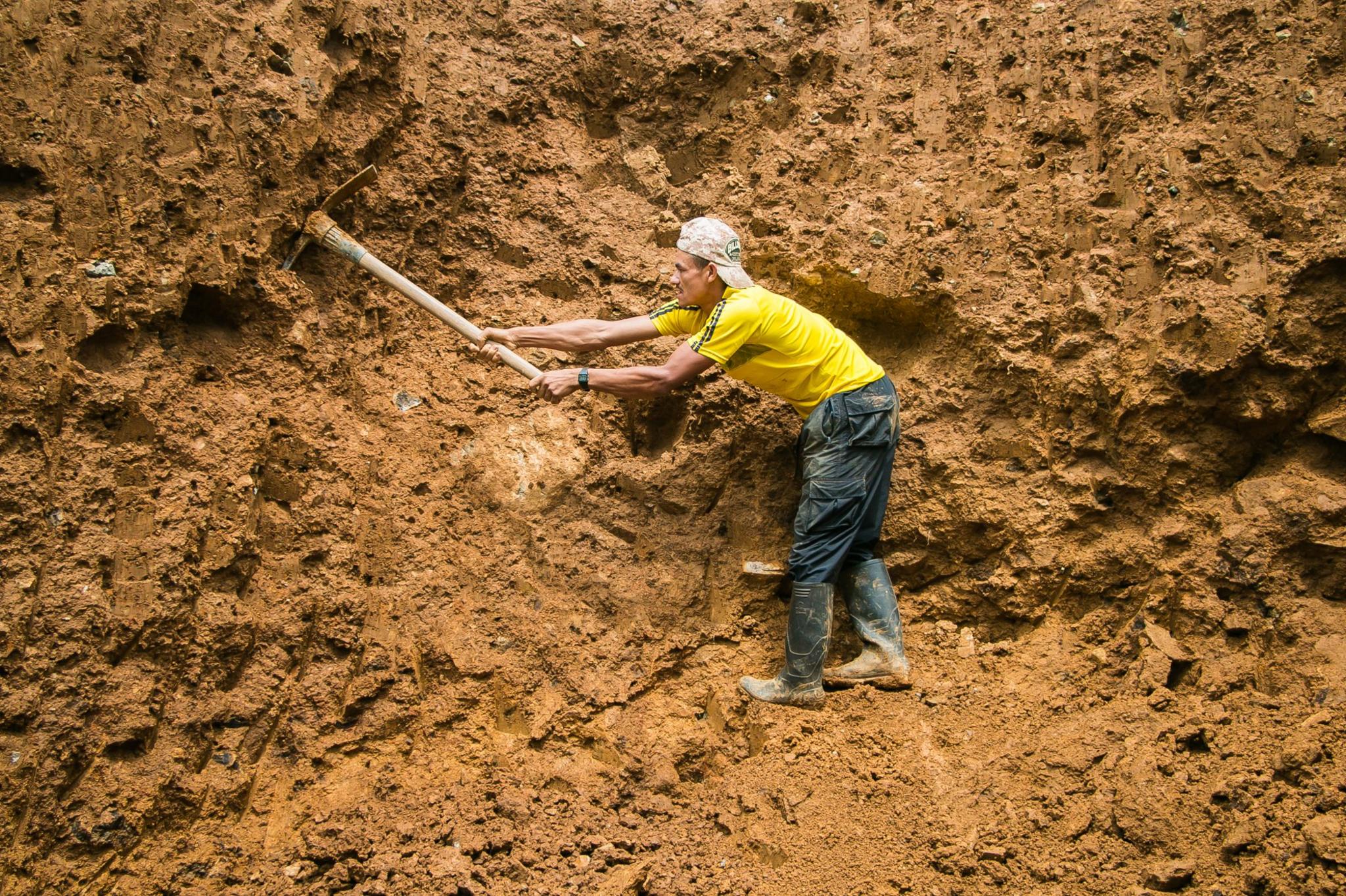 Farmers get together monthly to do community service such as building roads, July 2016