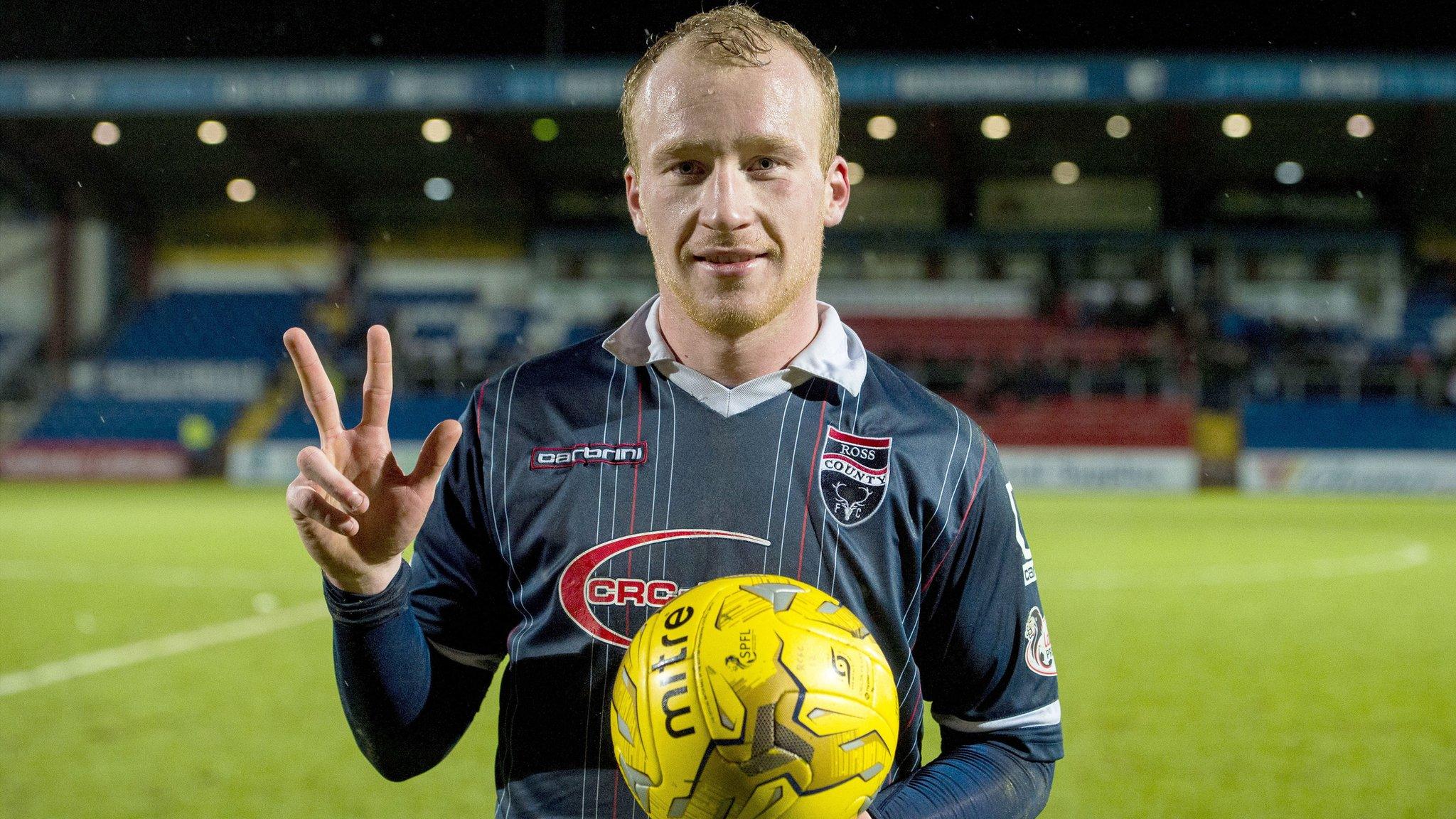 Liam Boyce celebrates after scoring a hat-trick for Ross County against Dundee