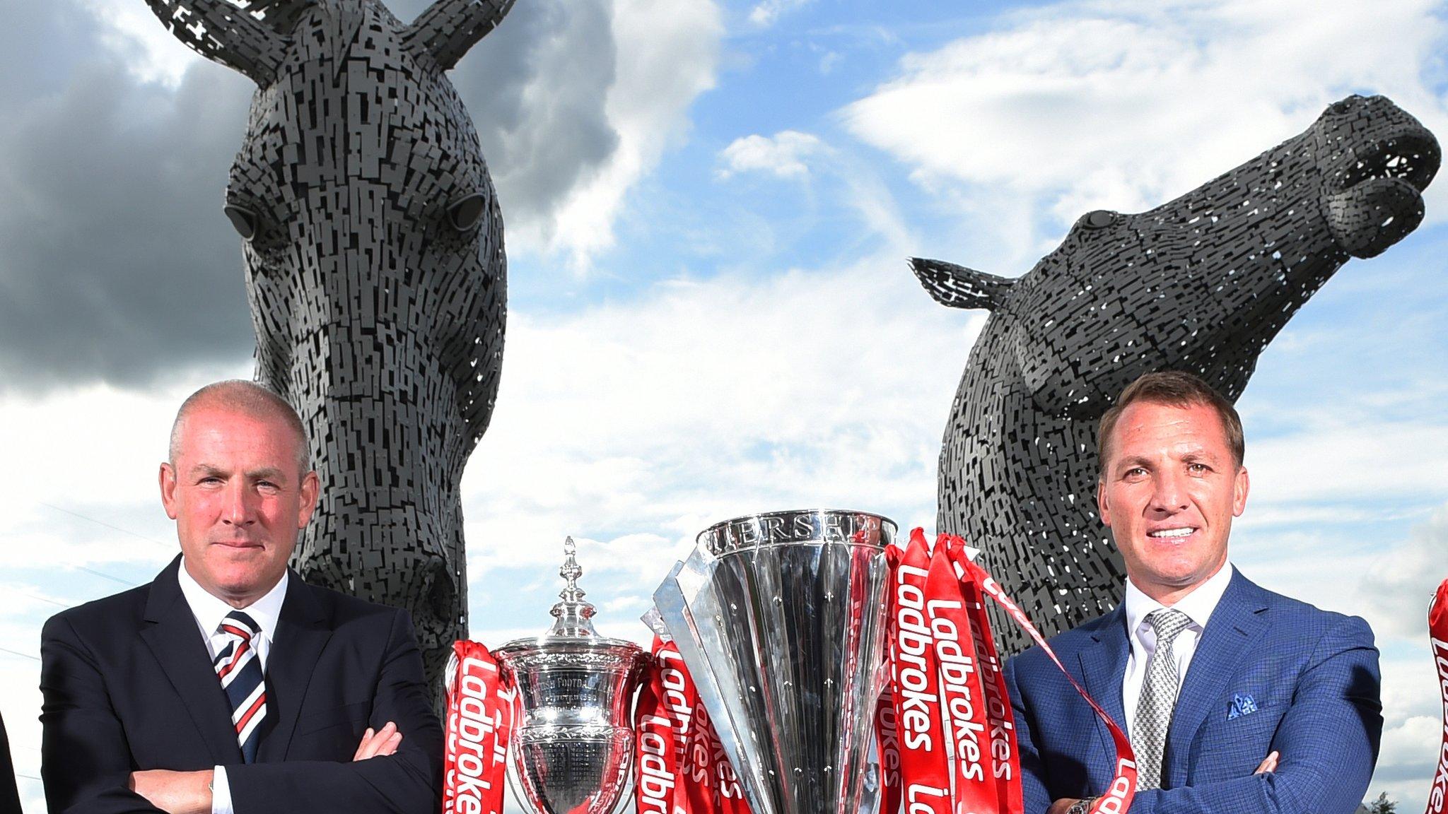 Rangers boss Mark Warburton (left) and Celtic manager Brendan Rodgers pose in front of the Falkirk 'Kelpies'