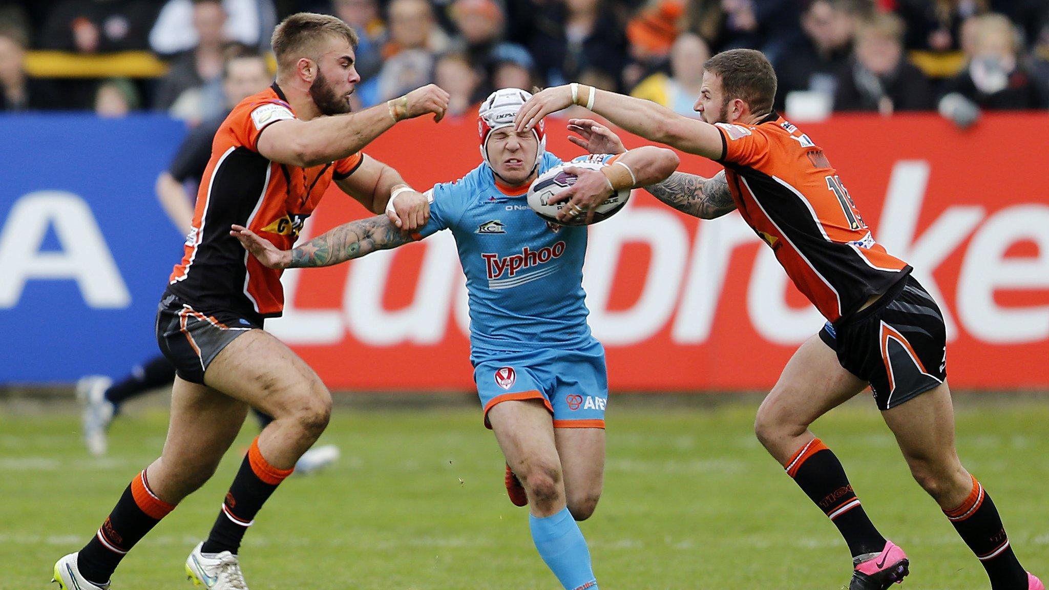 St Helens stand-off Theo Fages attempts to evade a Cas pincer movement led by Mike McMeeken and Ben Crooks at Wheldon Road