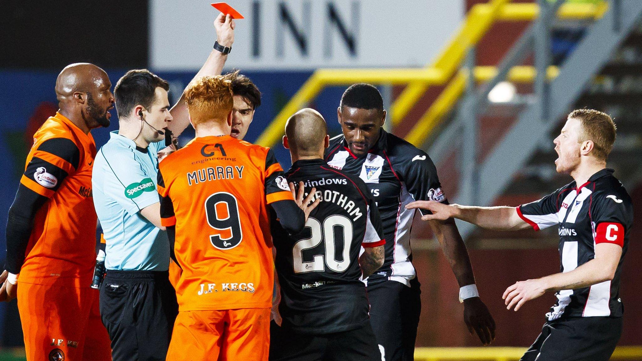 Dunfermline's Nate Wedderburn is shown a red card