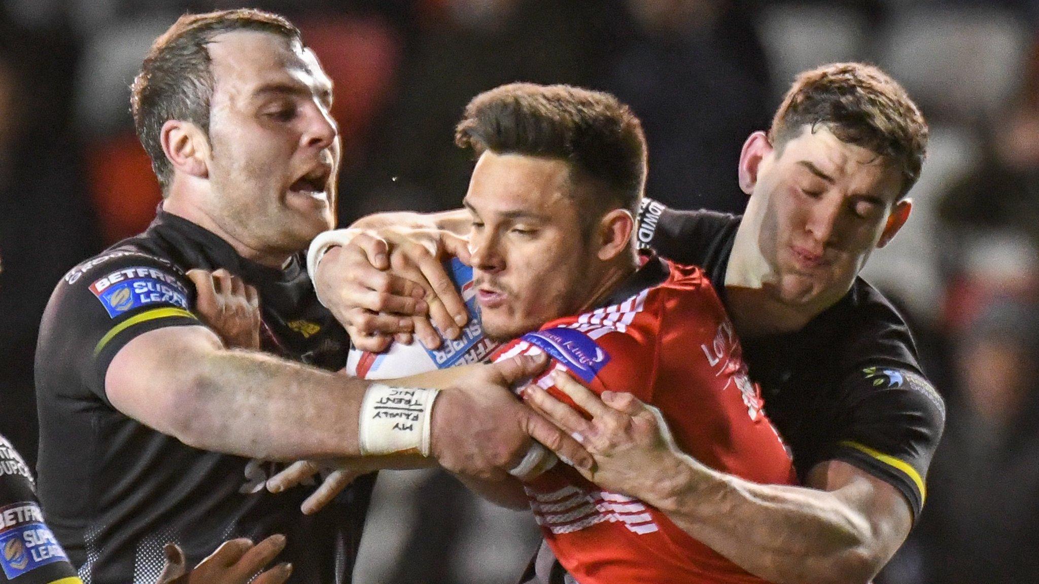 Widnes players surround the ball