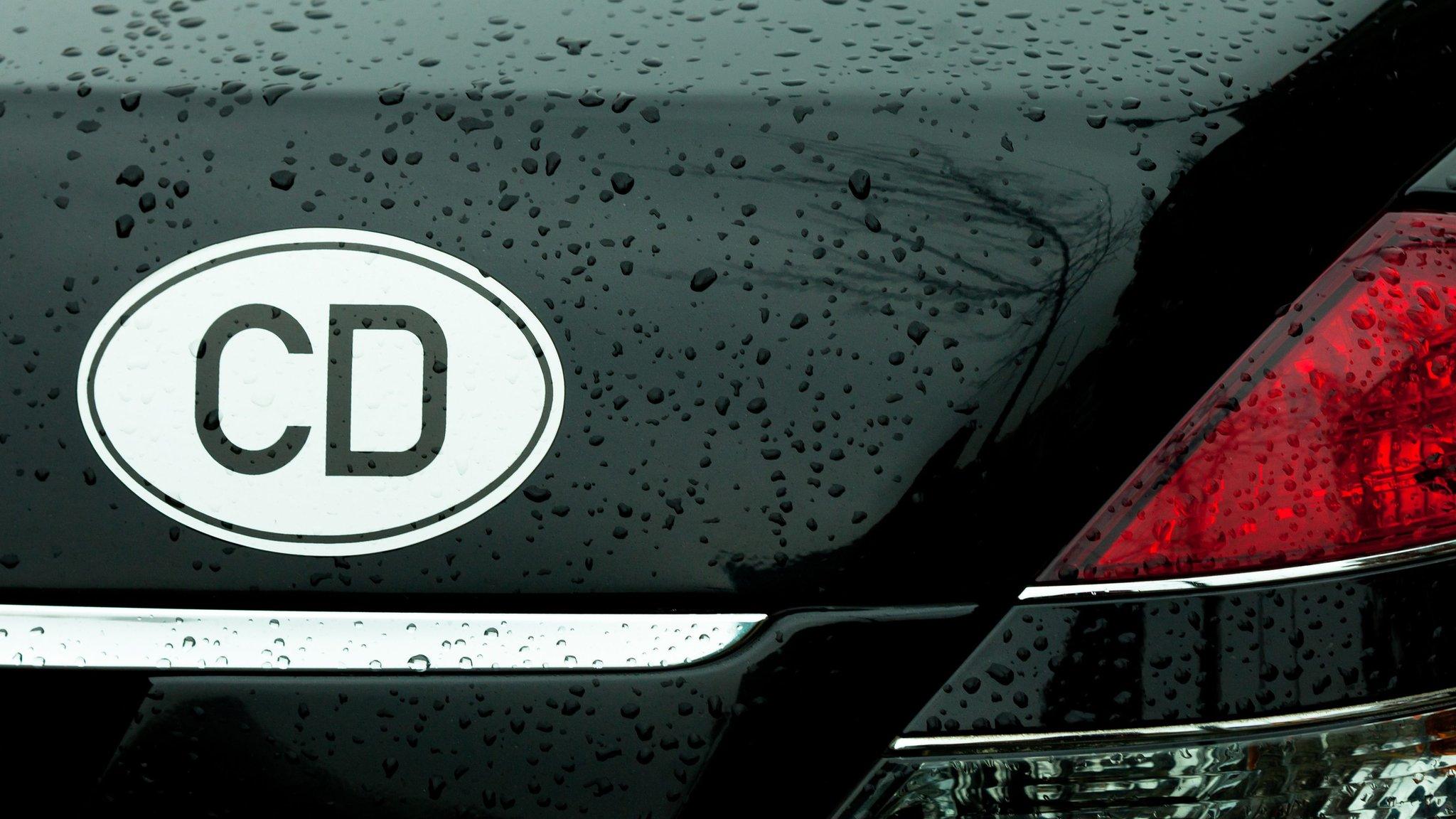 Car plates reading "CD"