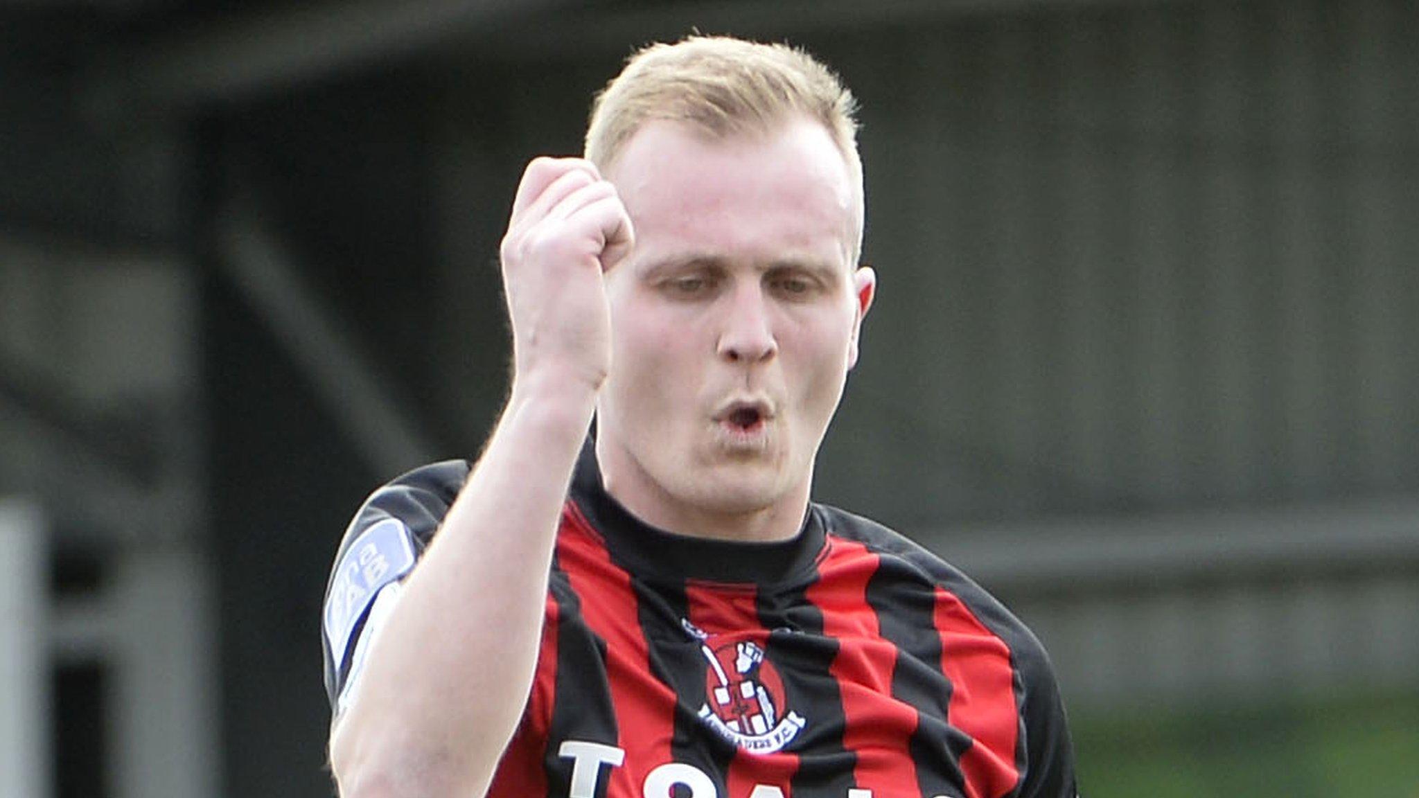 Jordan Owens celebrates after putting champions Crusaders ahead against Coleraine