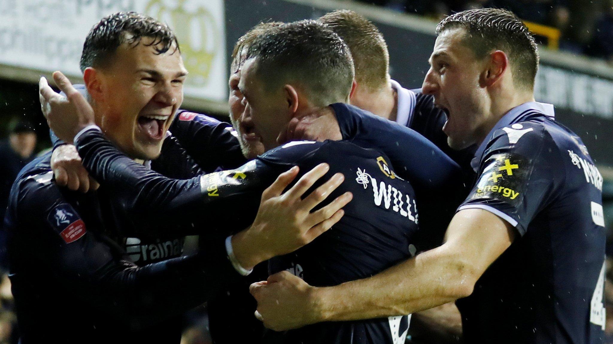 Millwall's players celebrate equalising against Everton