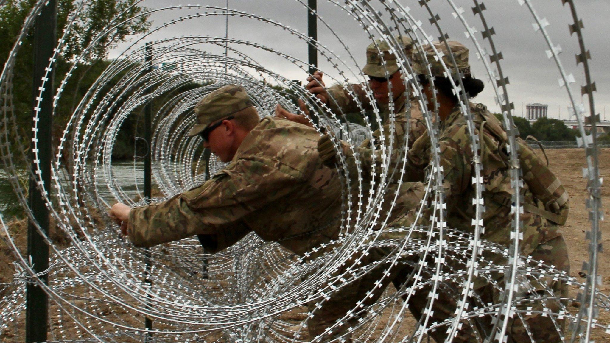 Soldiers from the Kentucky-based 19th Engineer Battalion install barbed and concertina-wire in Laredo, Texas, on November 17, 2018