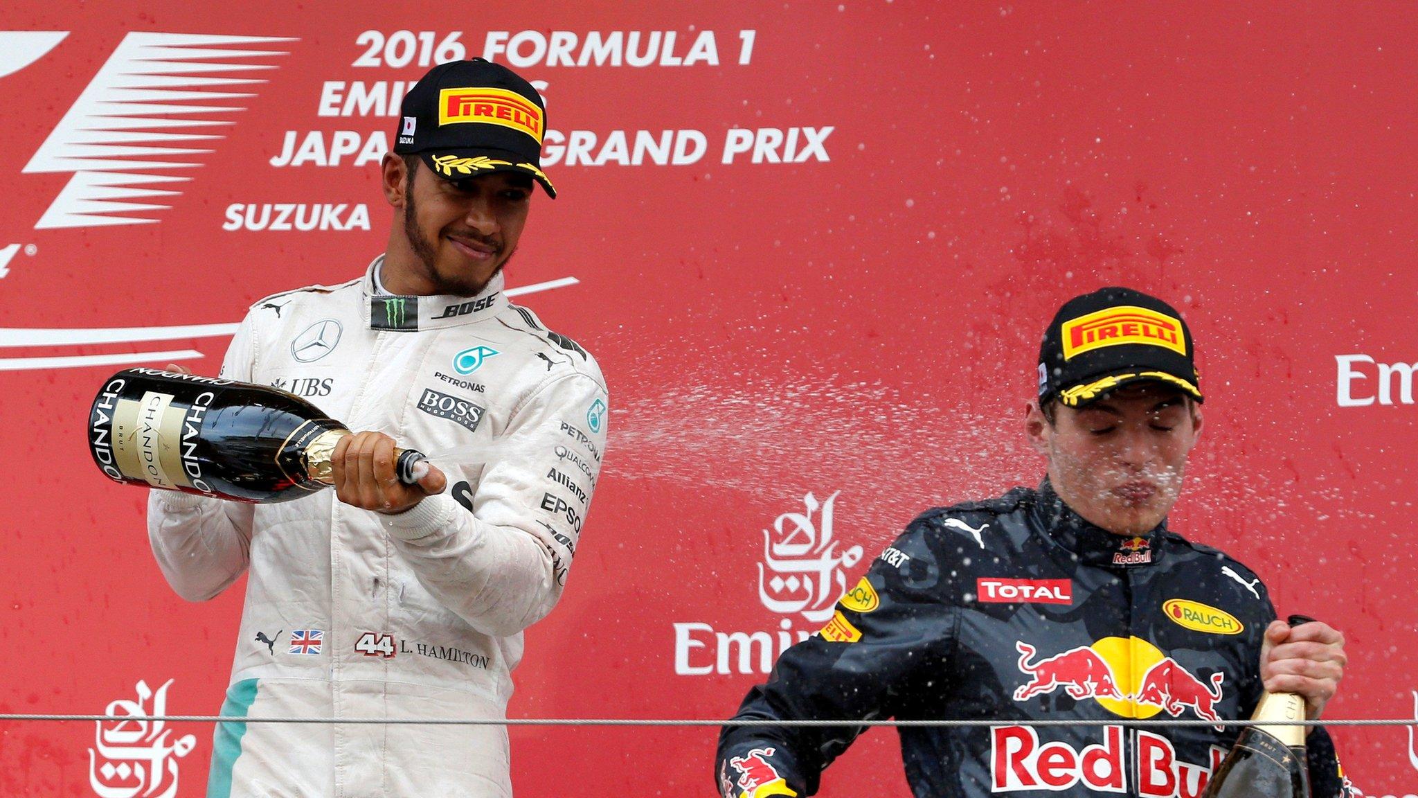 Lewis Hamilton (left) and Max Verstappen on the podium after the Japan Grand Prix