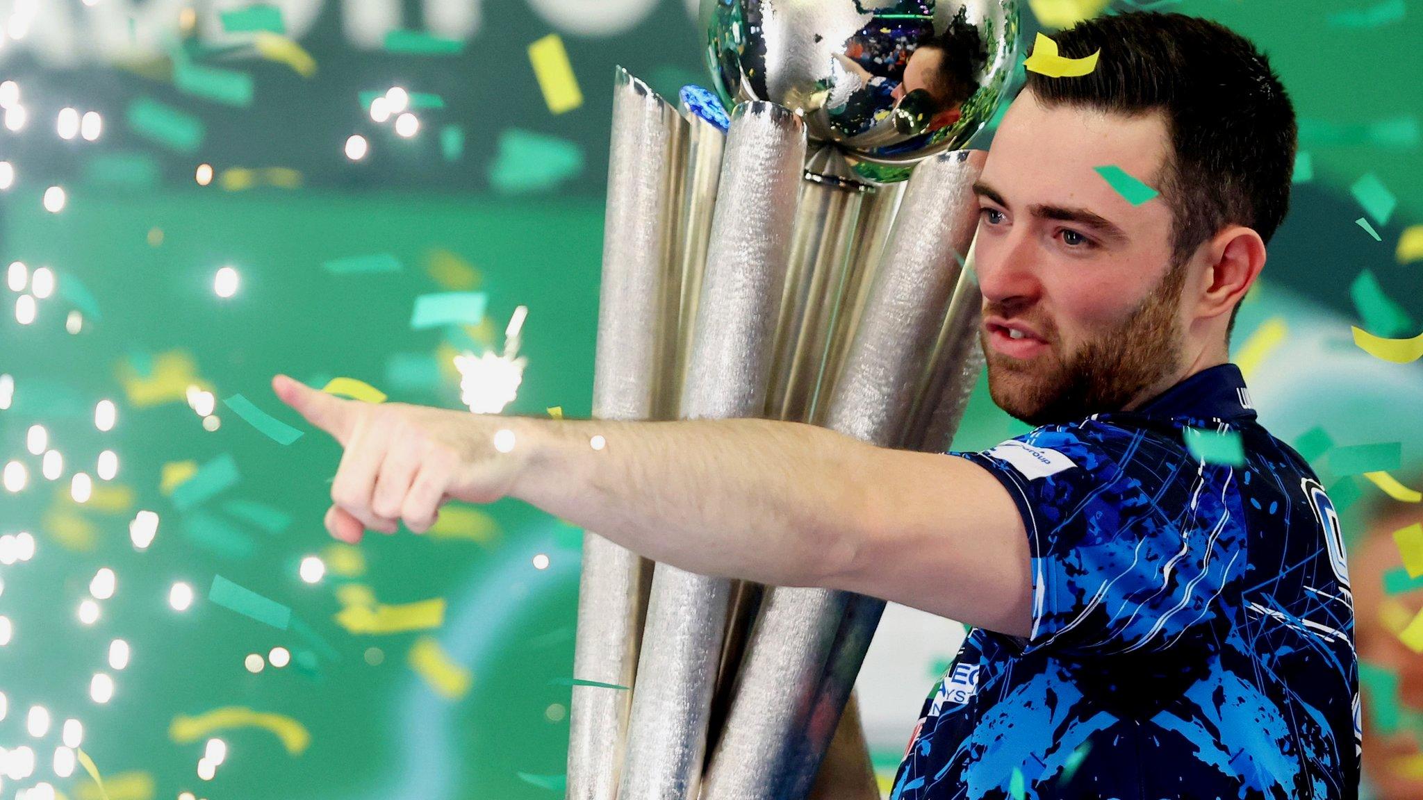 Luke Humphries celebrates winning the PDC World Darts Championship