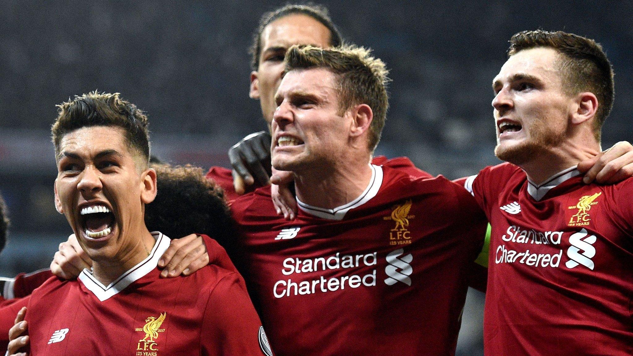 Liverpool's players celebrate scoring against Manchester City