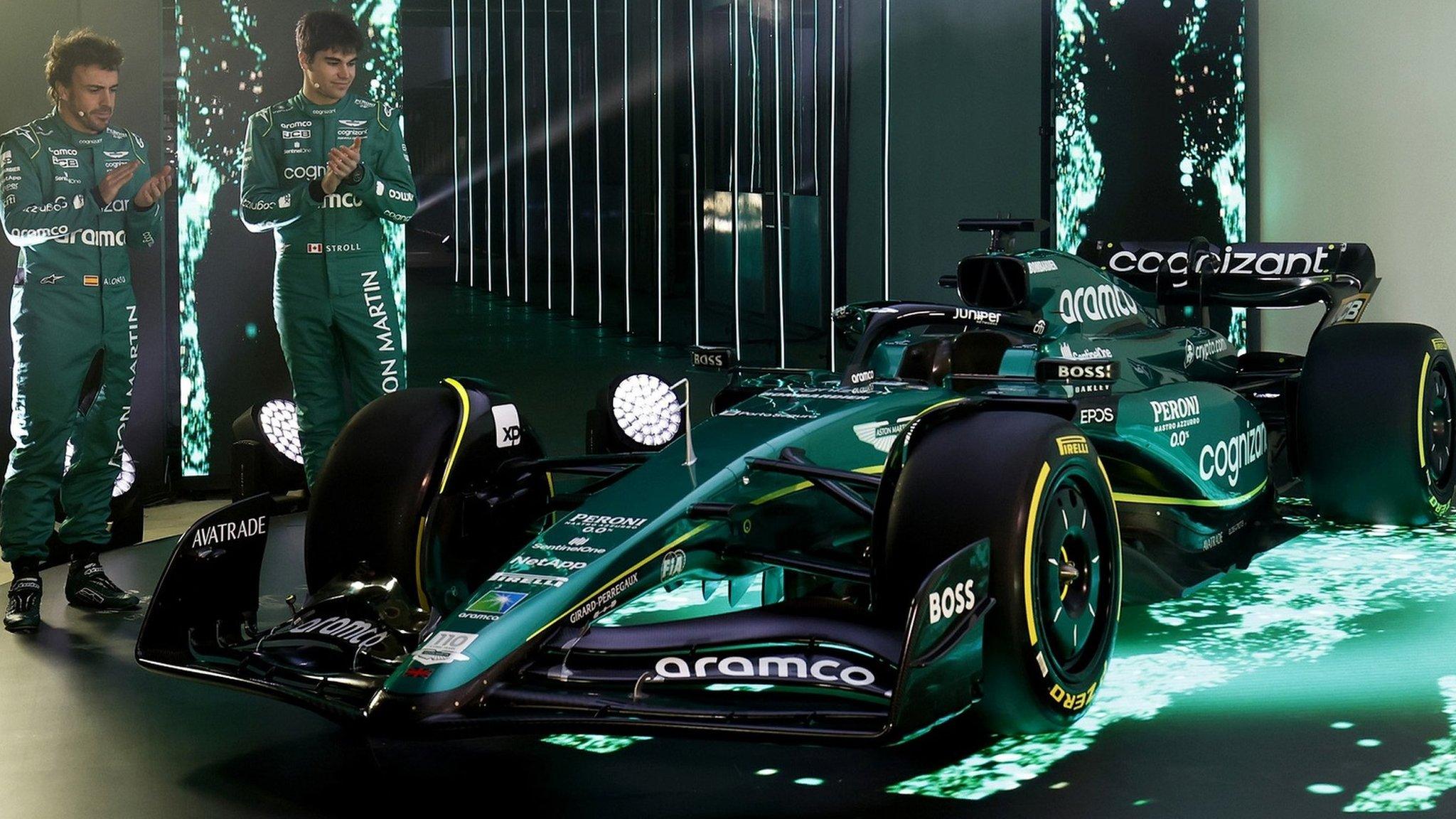 Fernando Alonso and Lance Stroll applaud the unveiling of Aston Martin's new F1 car