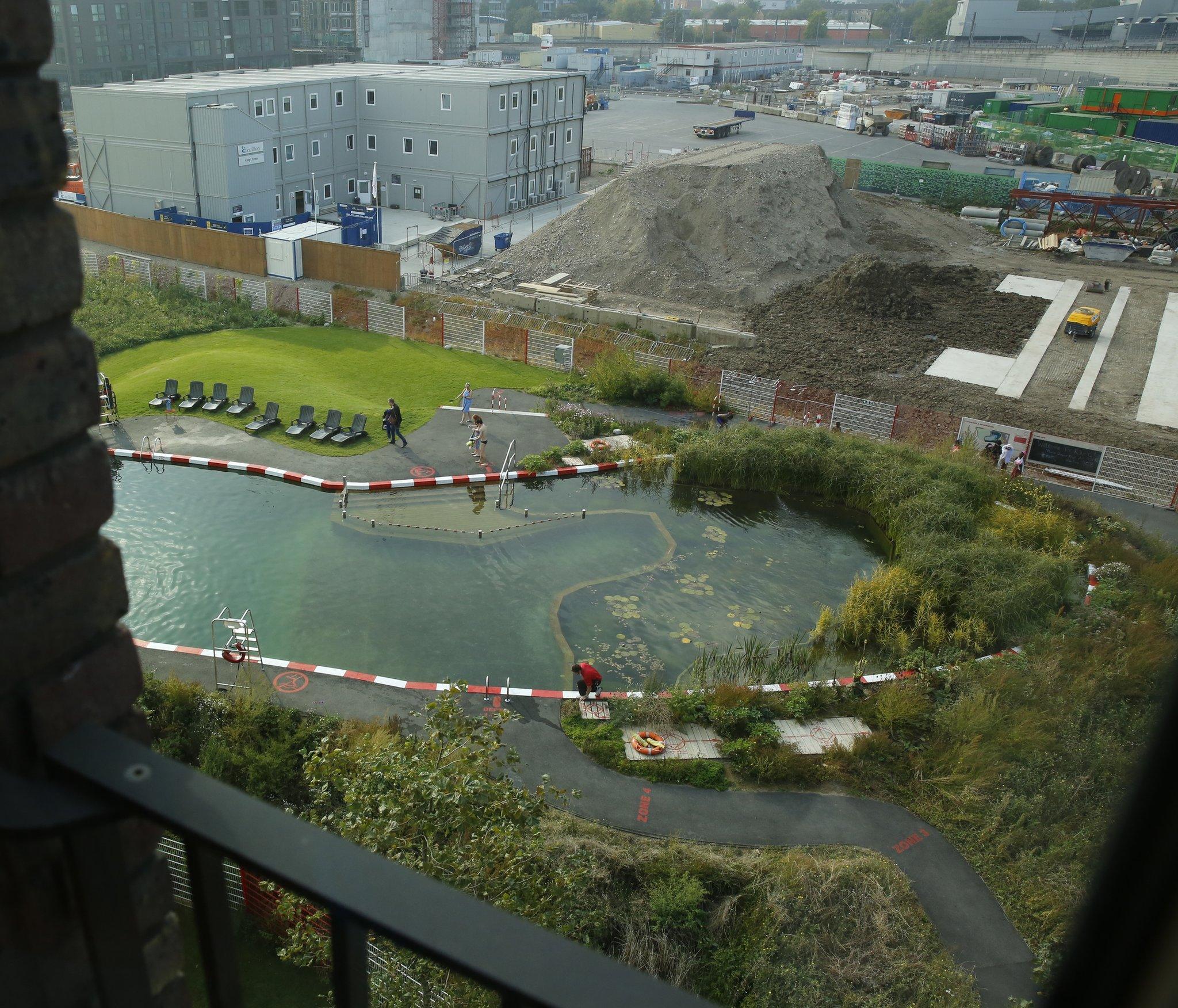 A man made swimming lake is part of a new development below Graham Pawley's flat