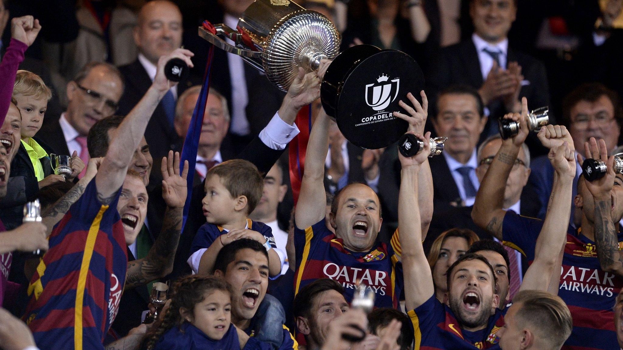 Andres Iniesta celebrates with the Copa Del Rey trophy