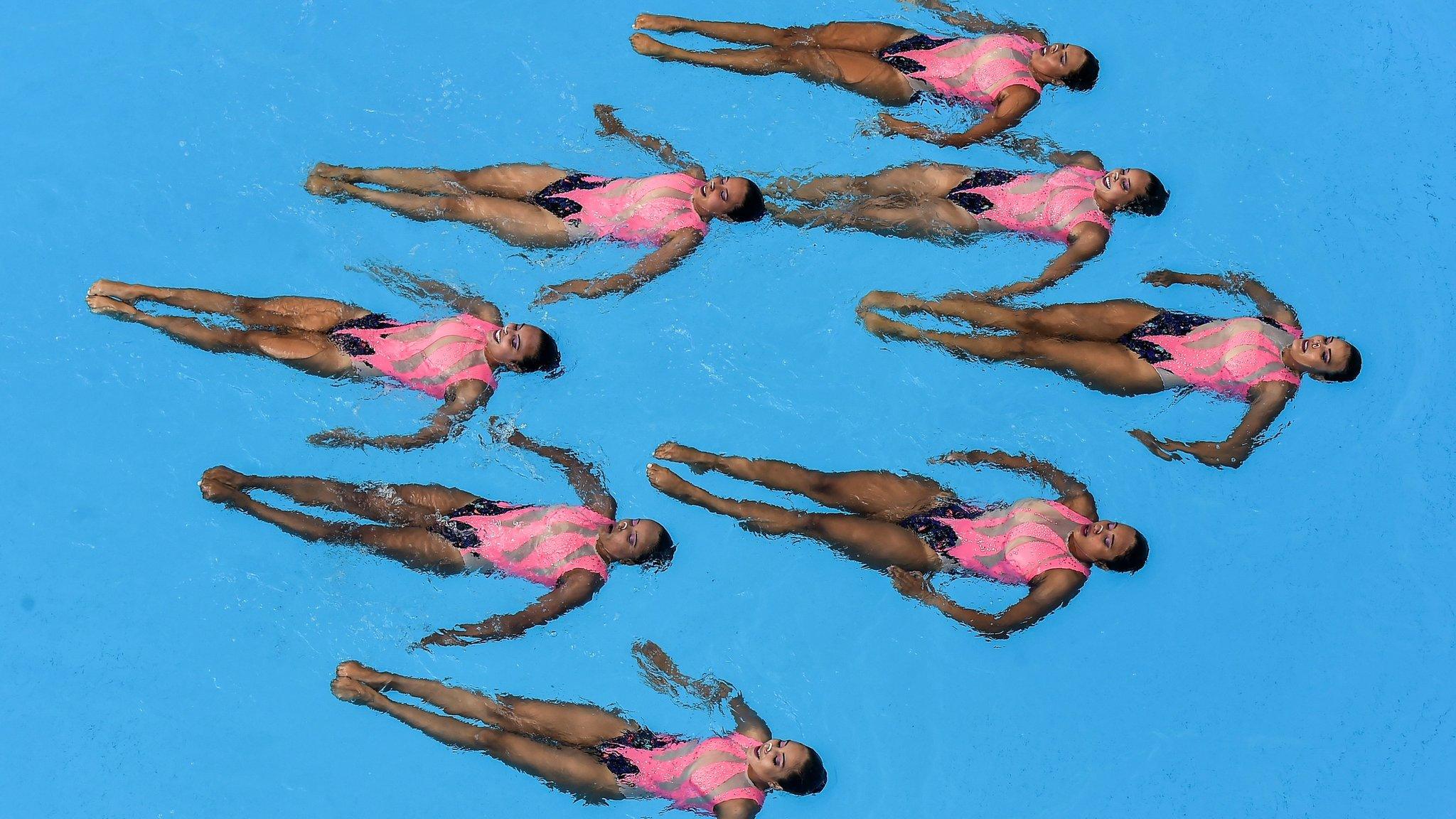 TOPSHOT - The Colombian team competes in the Women's Synchronized Swimming technical routine during the 2018 Central American and Caribbean Games (CAC), at the Aquatic Complex in Barranquilla, Colombia on July 30, 2018. - Mexico won the gold medal, Colombia silver and Venezuela bronze. (Photo by Luis ROBAYO / AFP) (Photo credit should read LUIS ROBAYO/AFP/Getty Images)