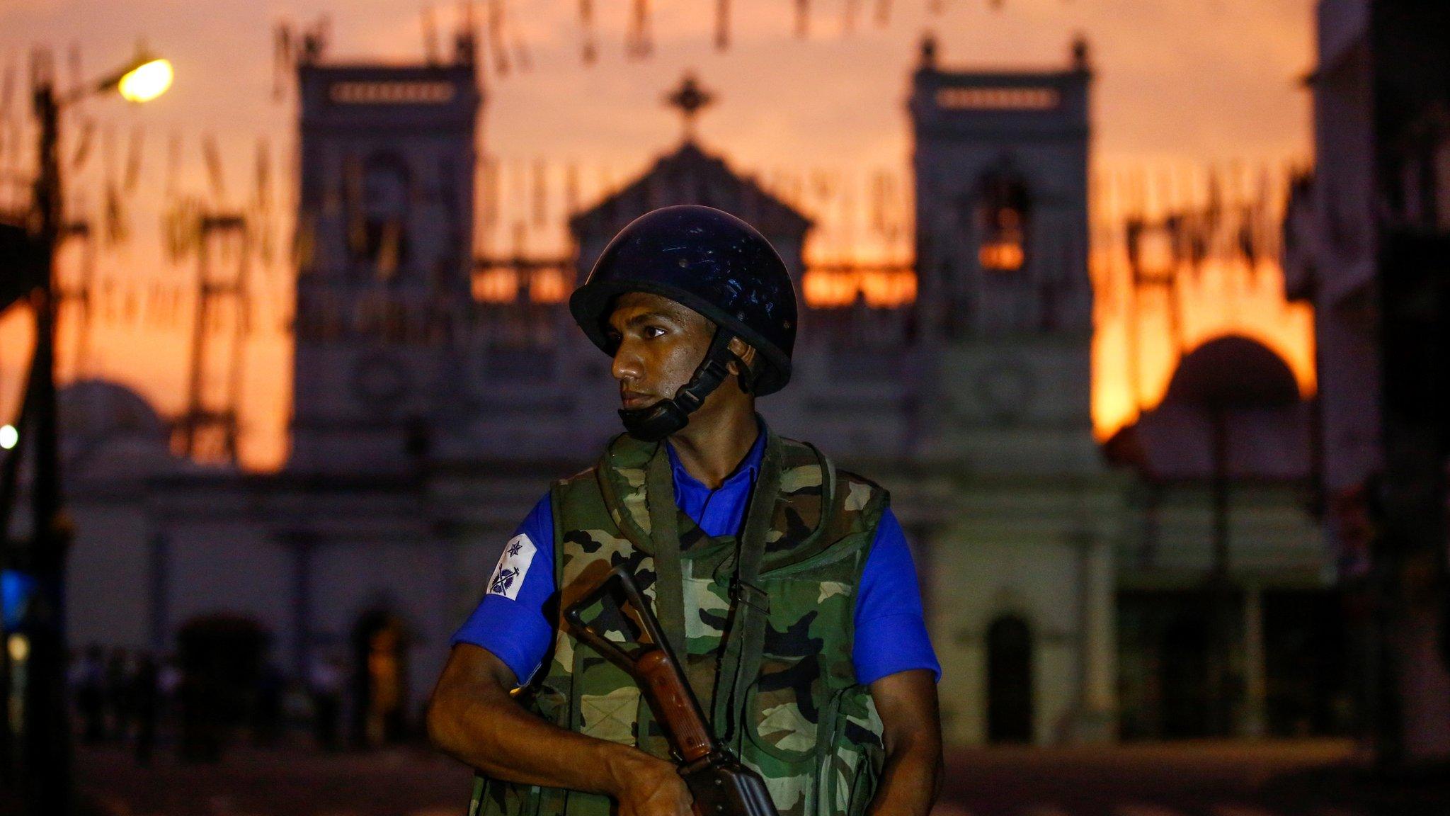 A security officer stands guard outside St. Antony"s Shrine, days after a string of suicide bomb attacks on churches and luxury hotels across the island on Easter Sunday, in Colombo