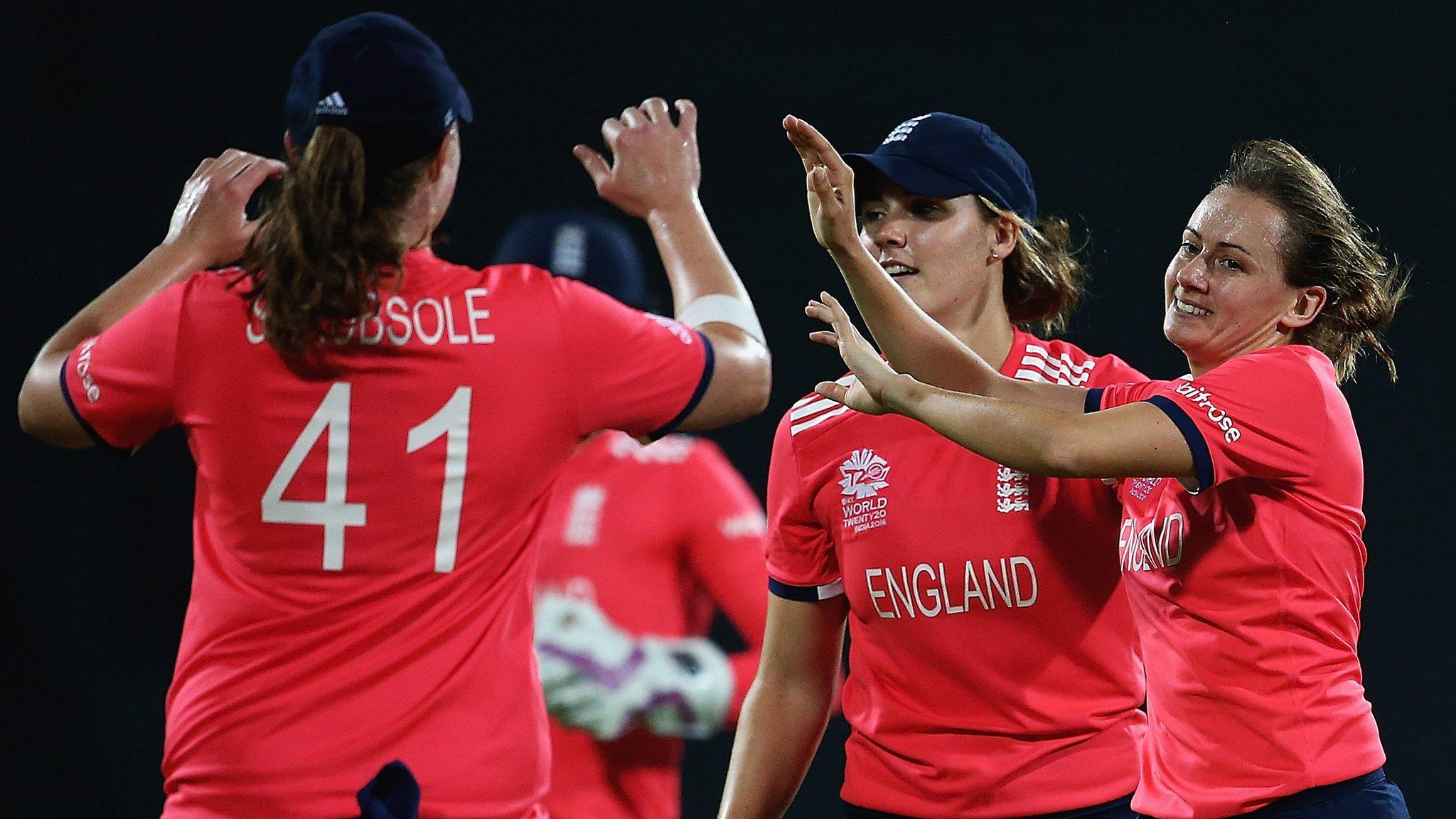 England celebrate a wicket by Laura Marsh (far right)