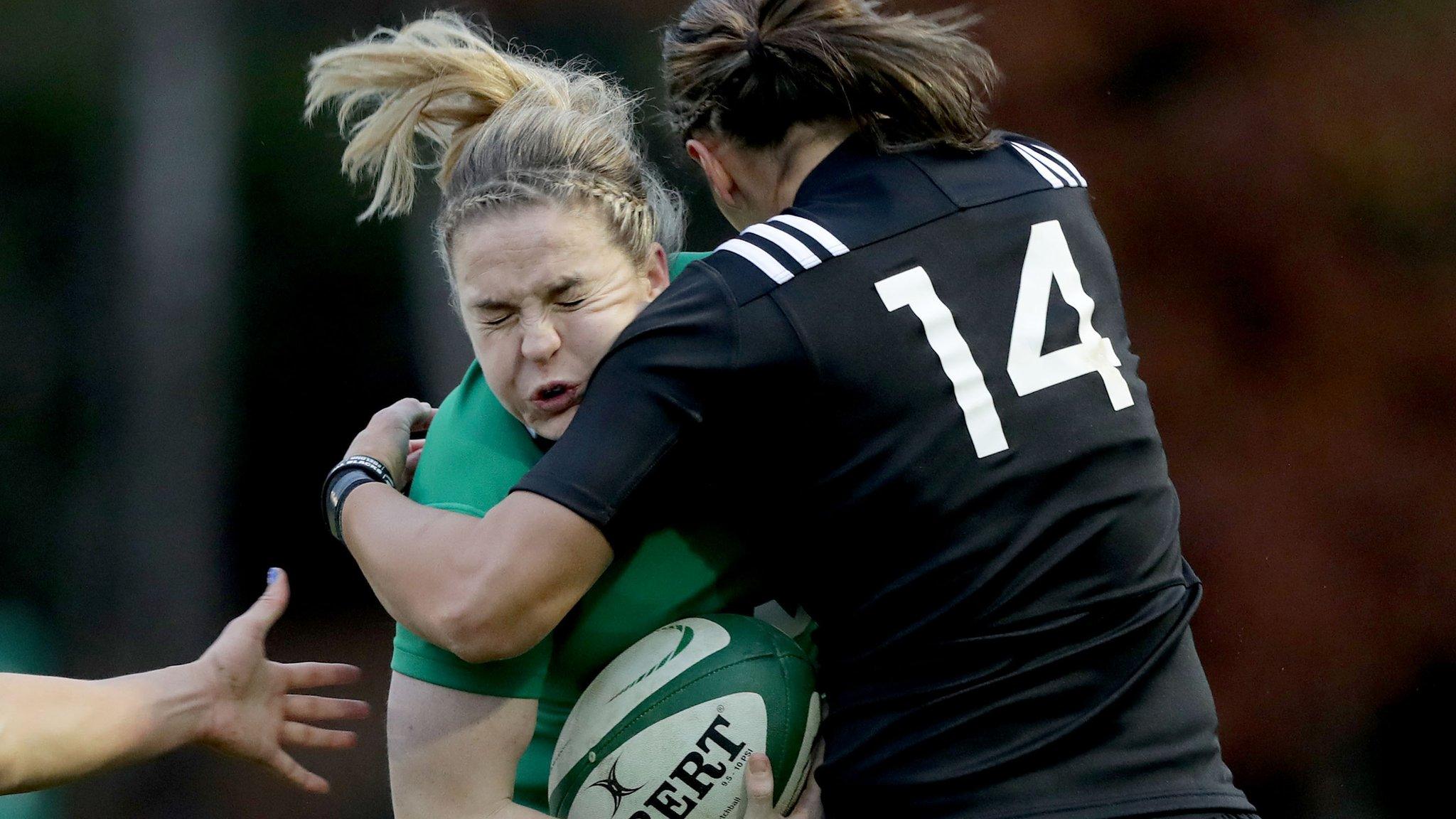 Ireland captain Niamh Briggs feels the impact of this heavy challange from Honey Hireme