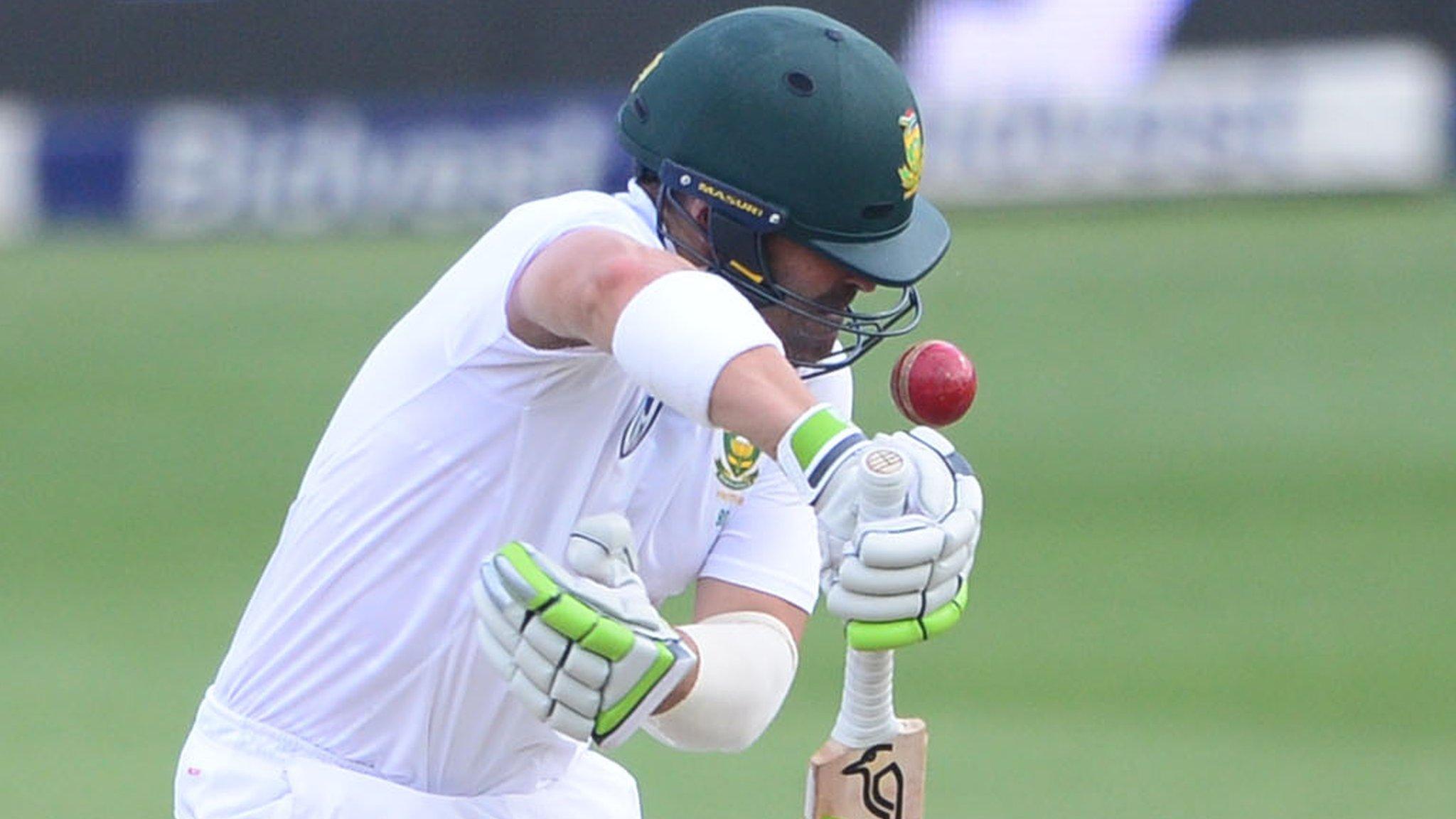 Dean Elgar is hit by a rising ball in Johannesburg