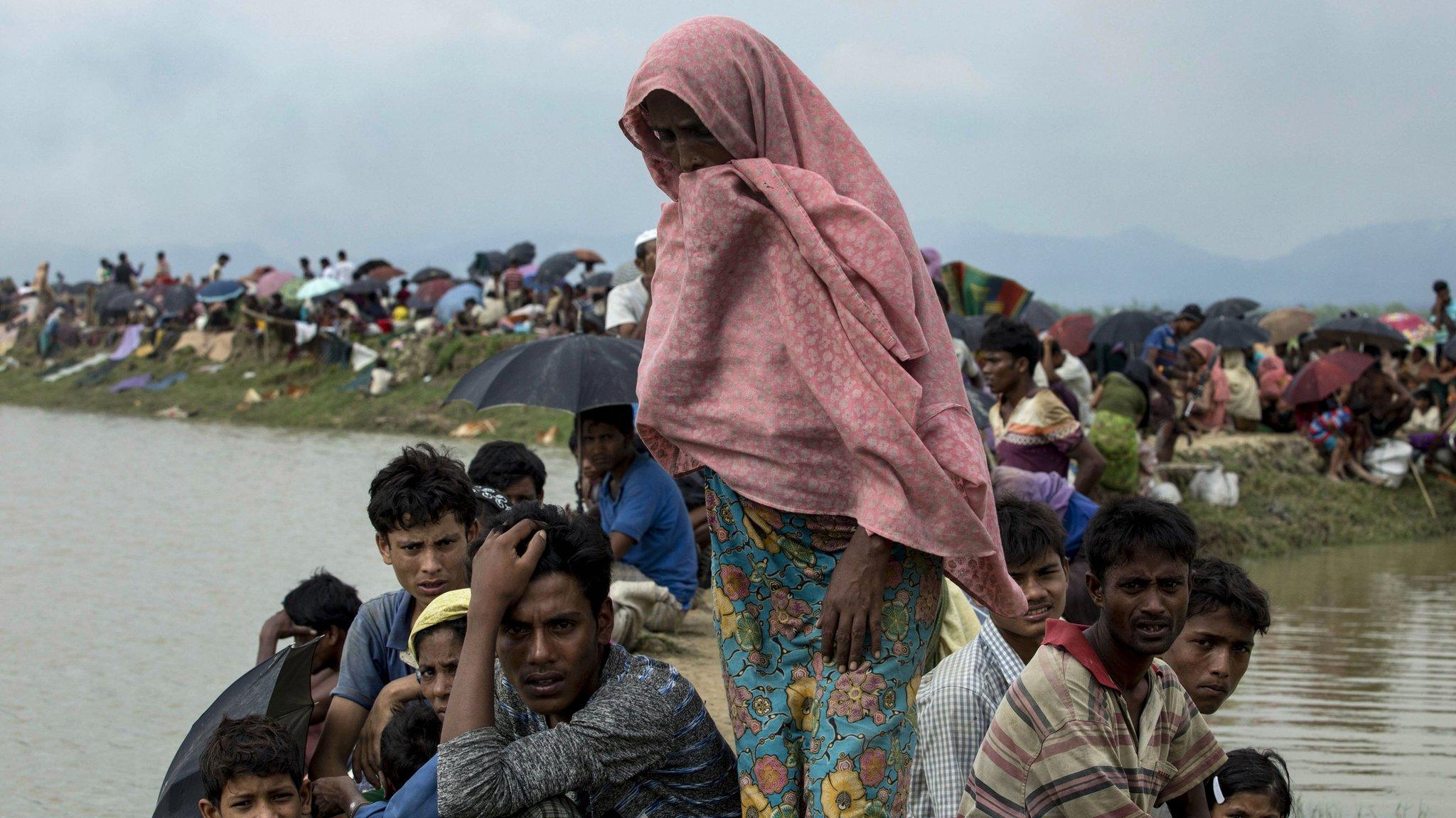 Displaced Rohingya refugees from Rakhine state in Myanmar rest near Ukhia, near the border between Bangladesh and Myanmar, as they flee violence on 4 September 2017