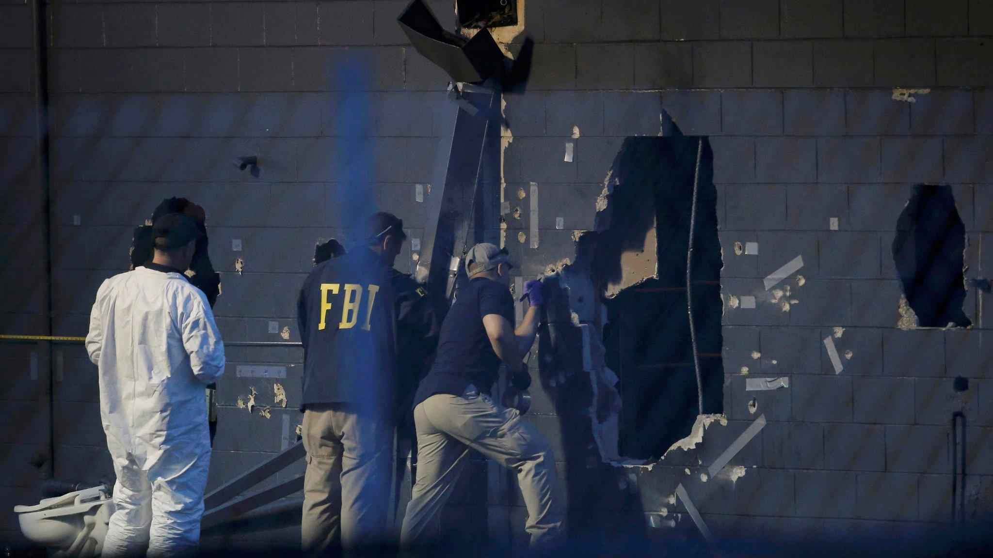 Police forensic investigators work at the crime scene of a mass shooting at the Pulse gay night club in Orlando, Florida, U.S. June 12, 2016