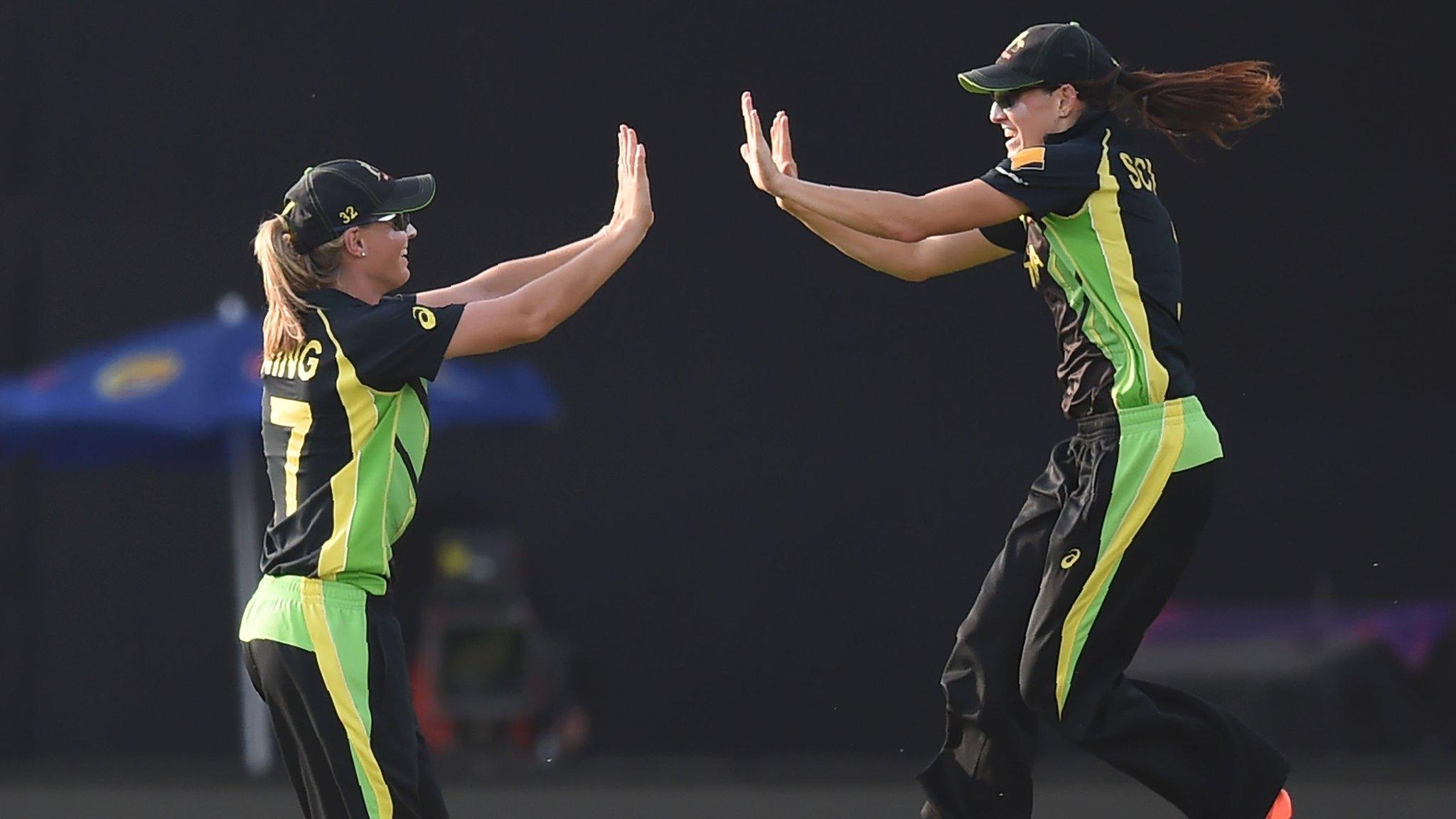 Australia's Megan Schutt (right) and Meg Lanning (left) celebrate after victory in the World Twenty20 women's cricket tournament semi-final match