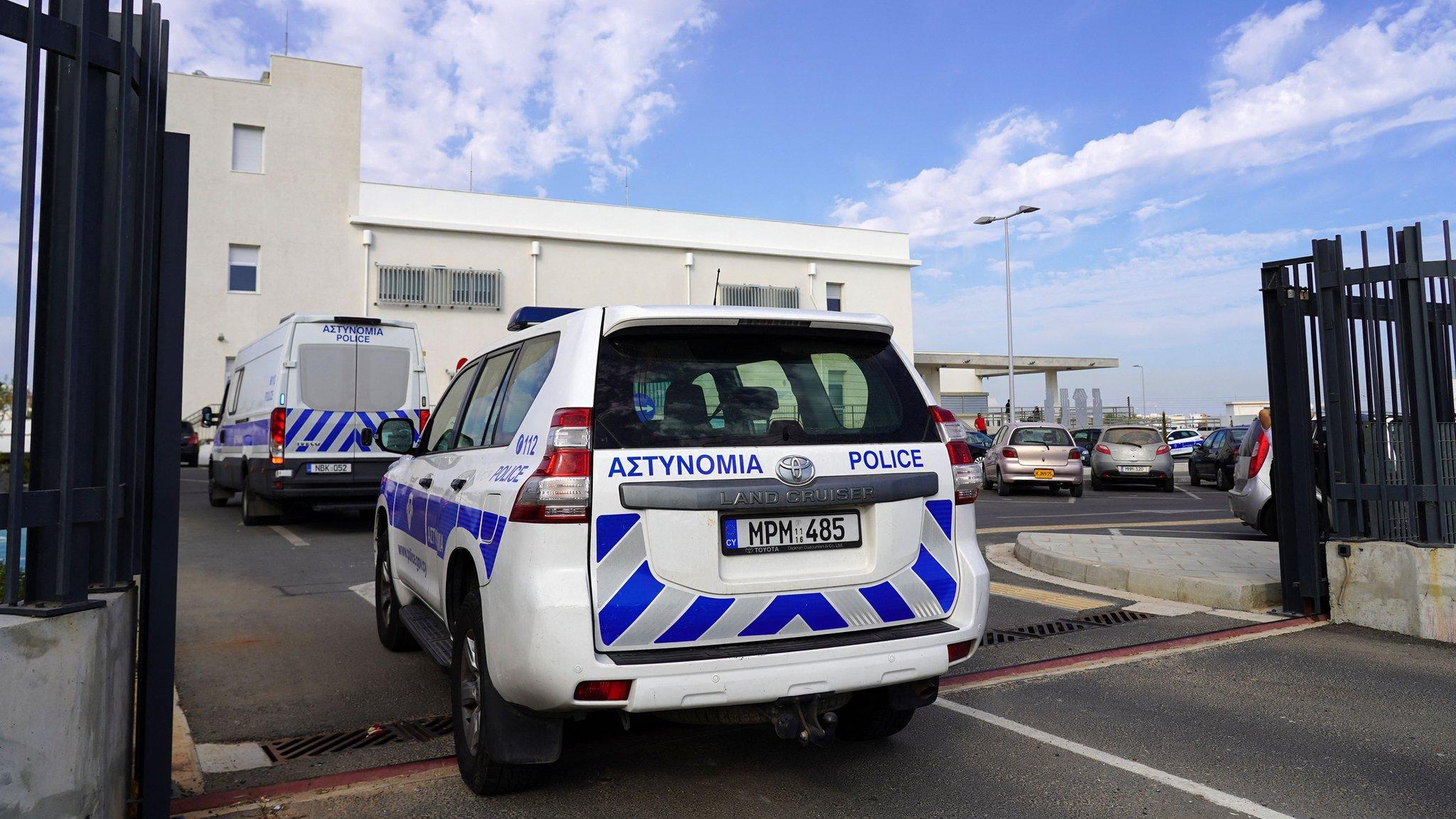 Cypriot police cars transport five Israeli men accused of raping a British tourist to the Famagusta district court in Paralimni, Cyprus (5 October 2023)