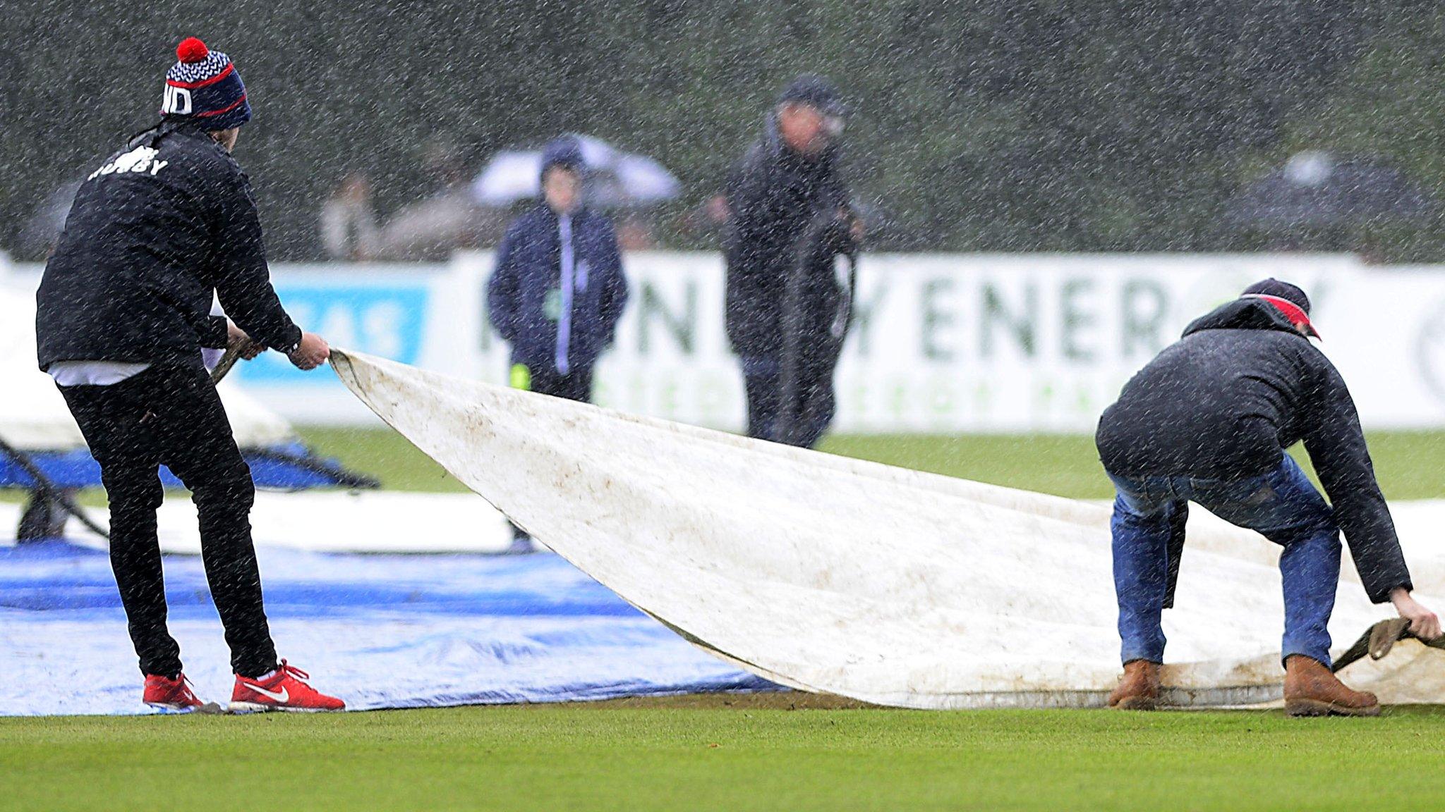 A shower just after 13:00 BST ended any slim hopes of the game starting