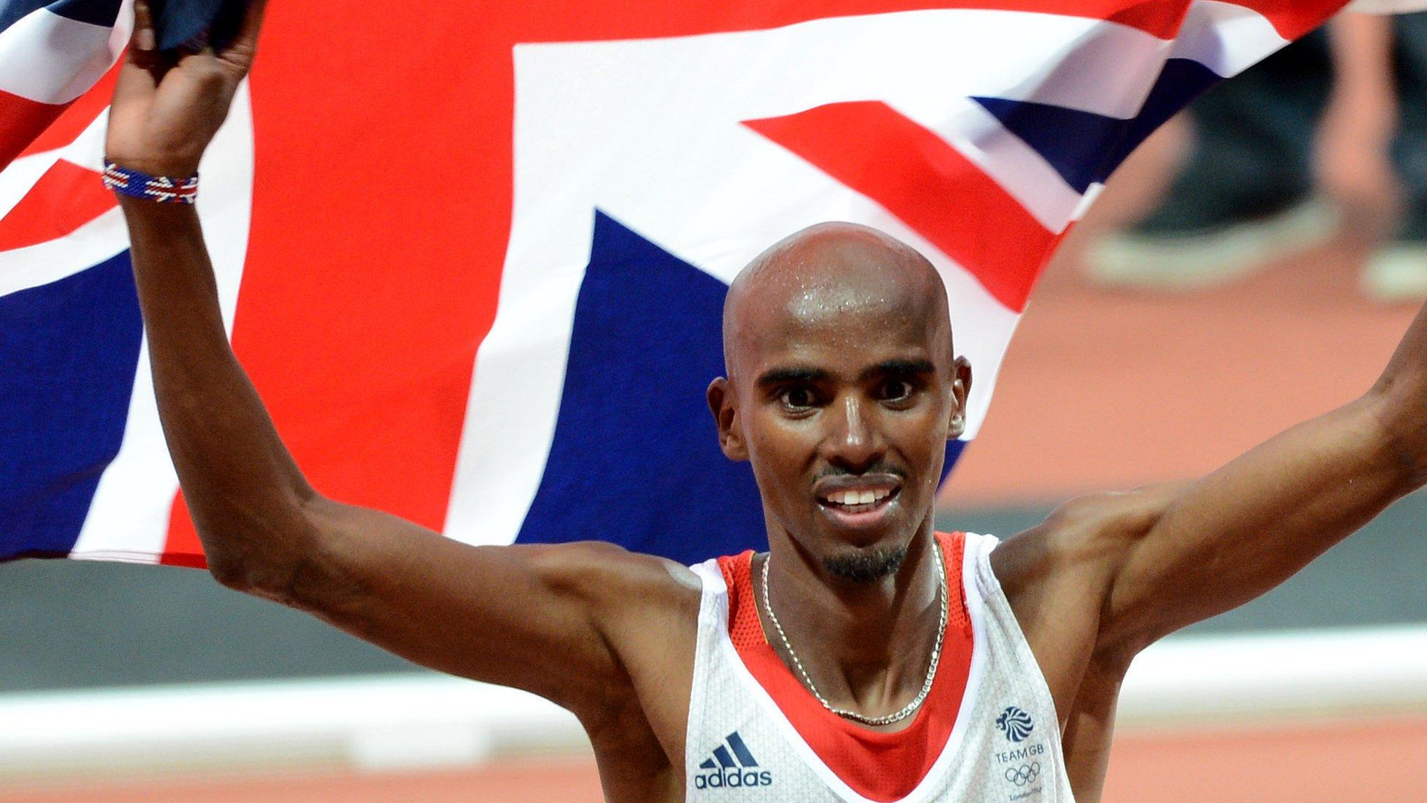 Sir Mo Farah waving a Union Flag for Team GB