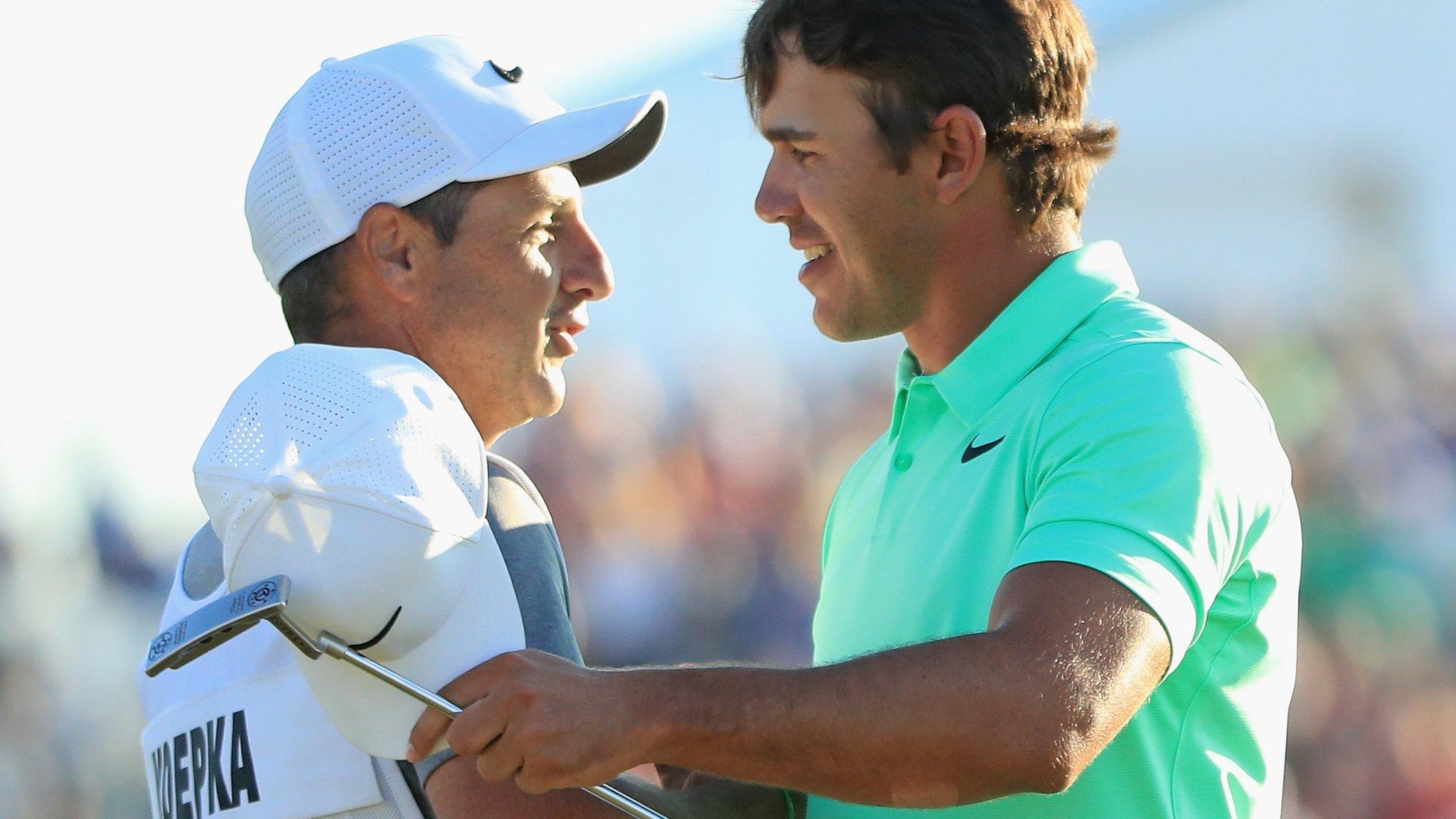 Caddie Ricky Elliott and Brooks Koepka embrace celebrate the US Open victory