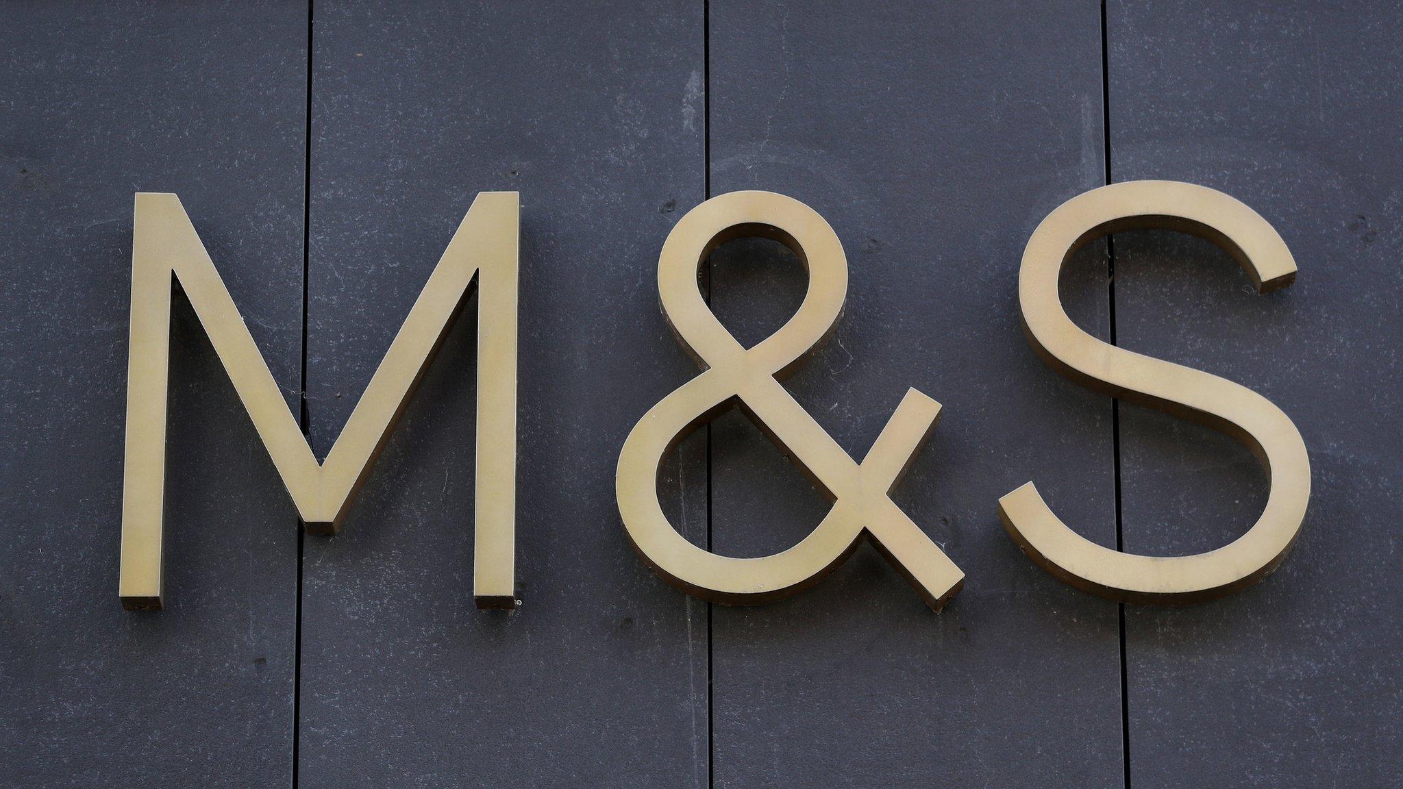 M&S logo on a dark exterior wall