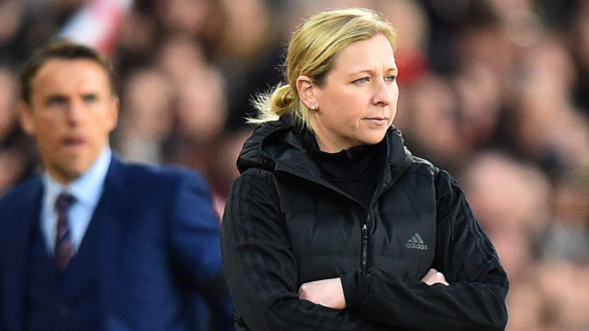 Wales manager Jayne Ludlow (foreground) and England boss Phil Neville