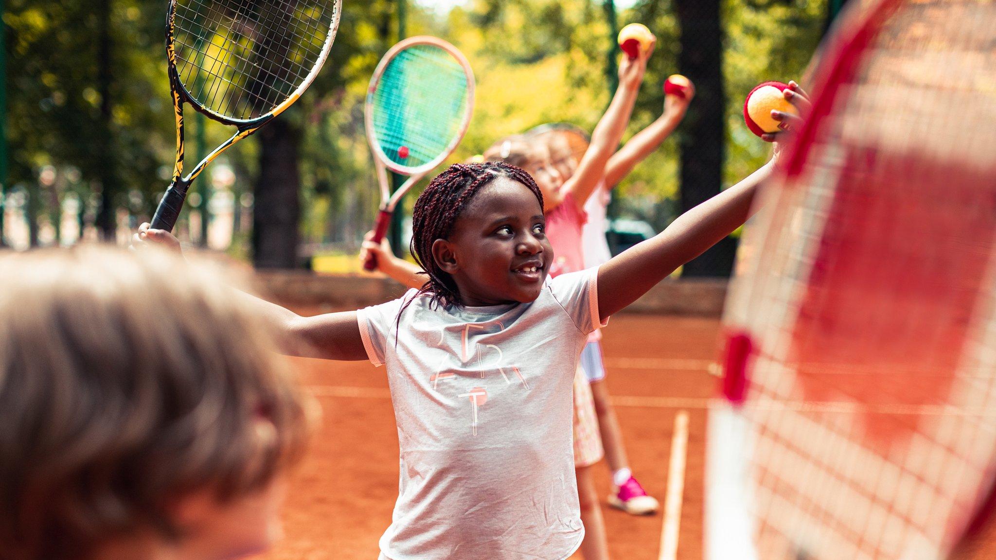 Kid playing tennis