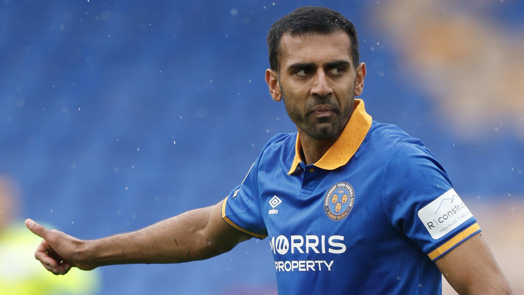 Shrewsbury defender Malvind Benning gives a thumbs up during a game