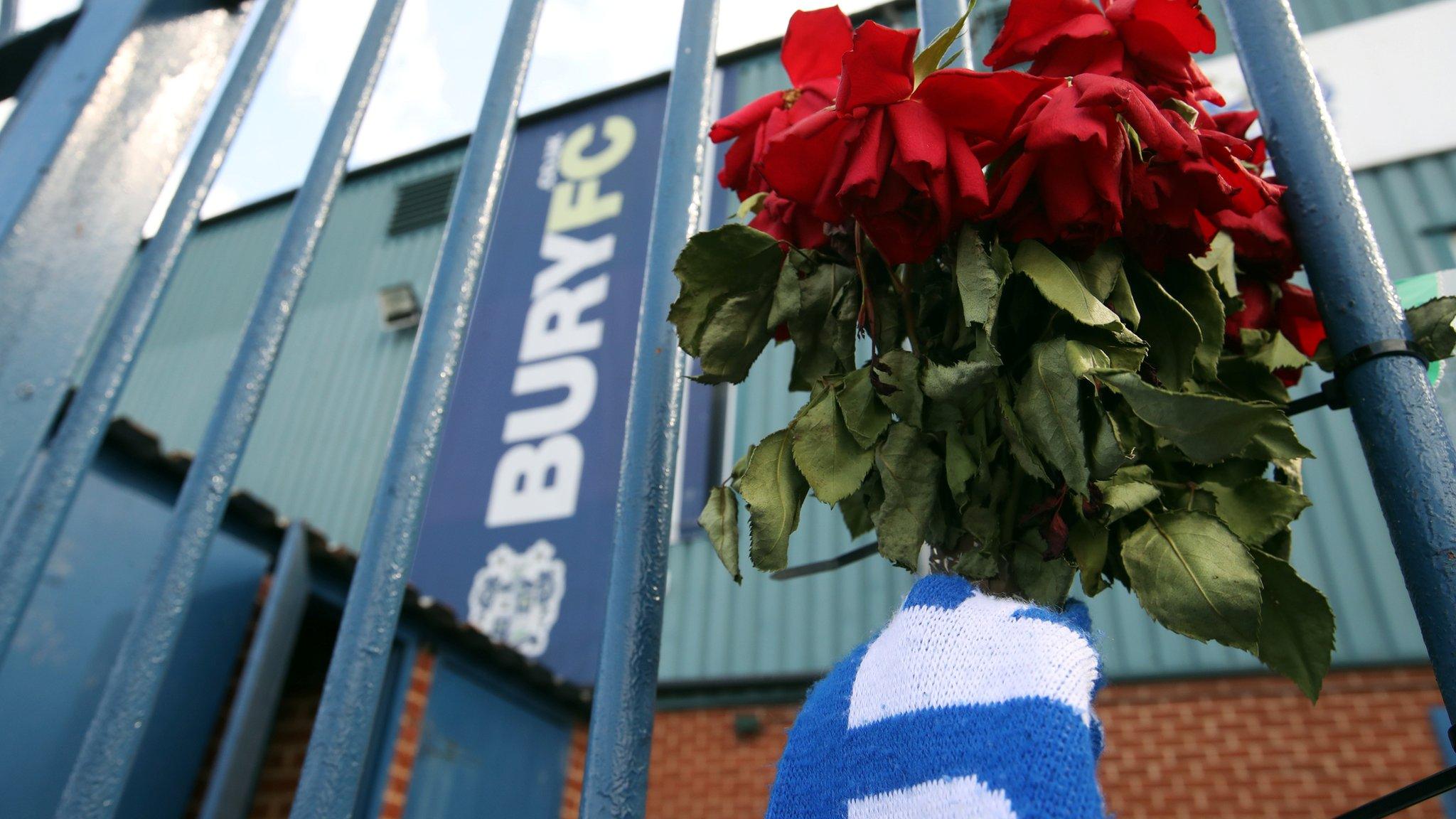 Flowers left outside Bury's Gigg Lane ground