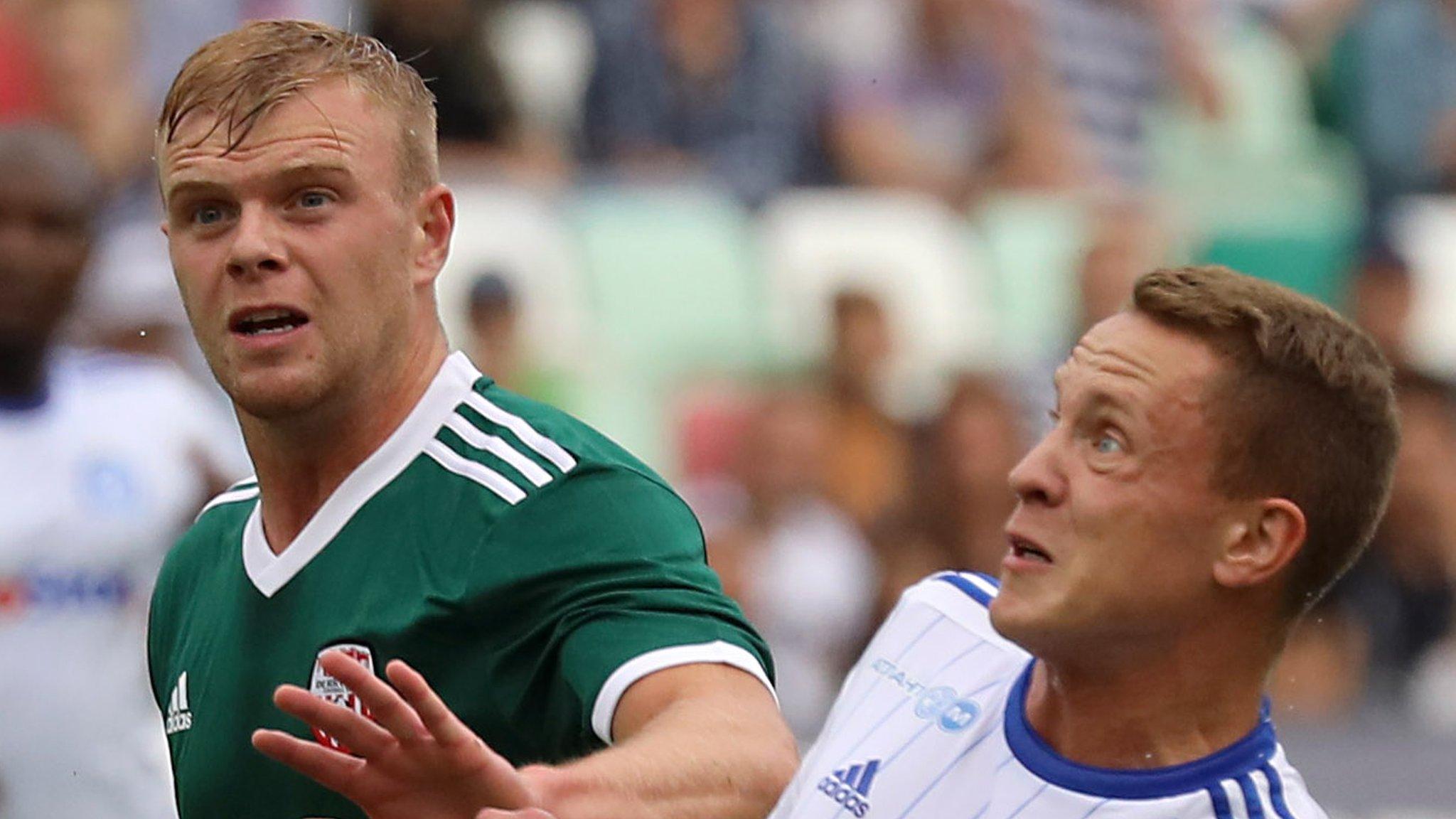 Derry City's Aaron Splaine with Artem Bykov of Dinamo Minsk