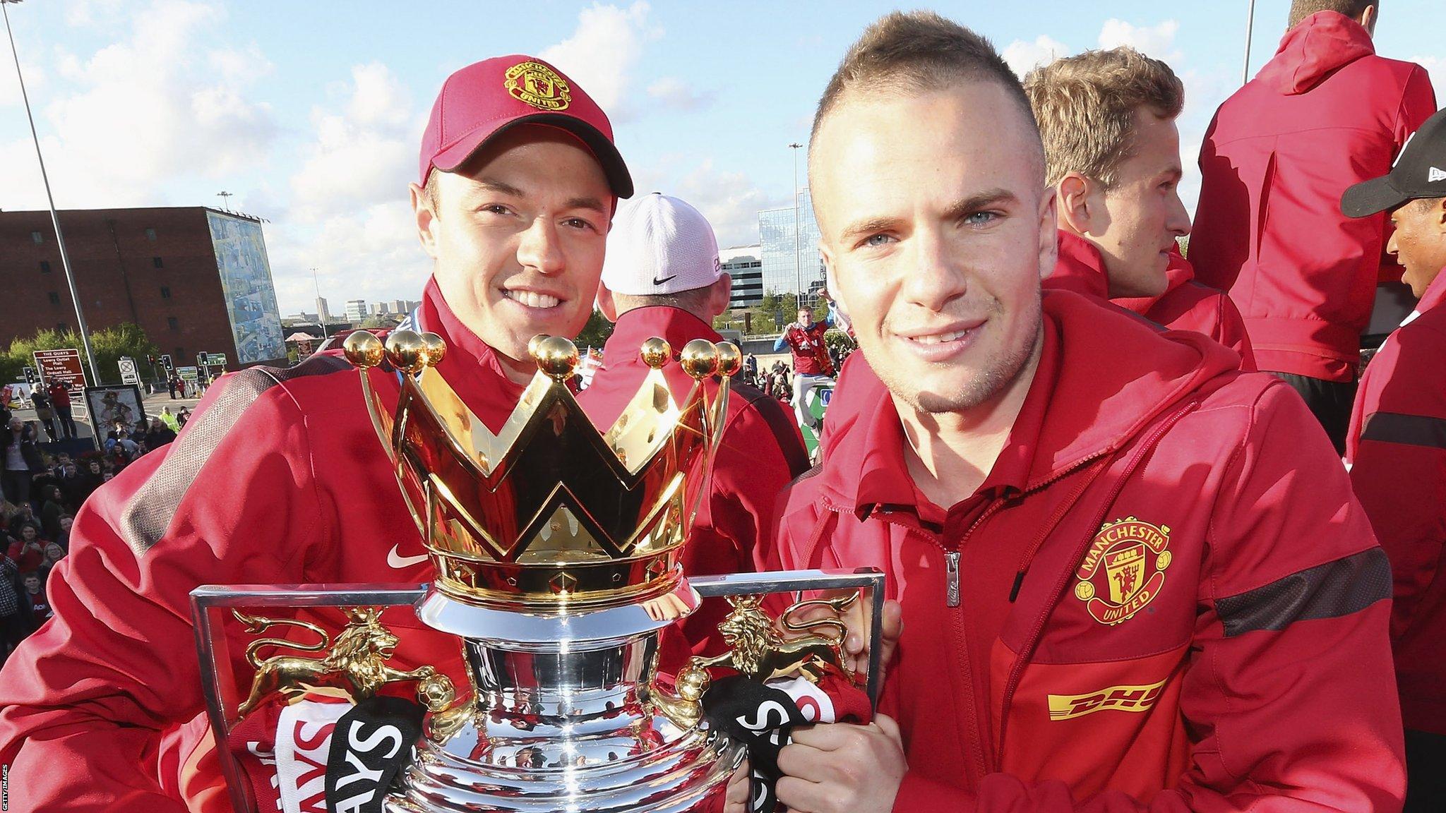 Jonny Evans and Tom Cleverley with the 2012-13 Premier League trophy