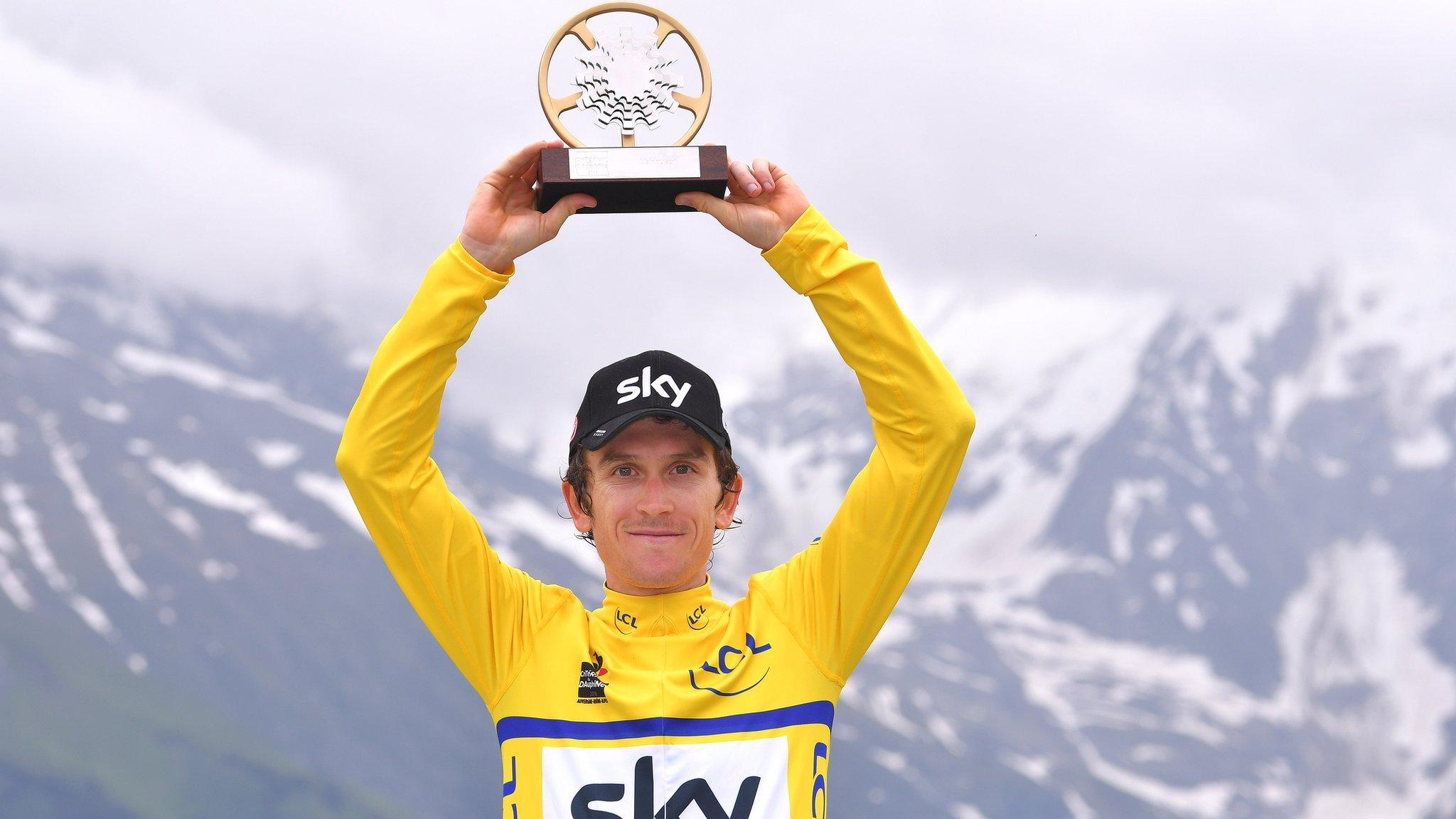 Geraint Thomas holds the trophy aloft