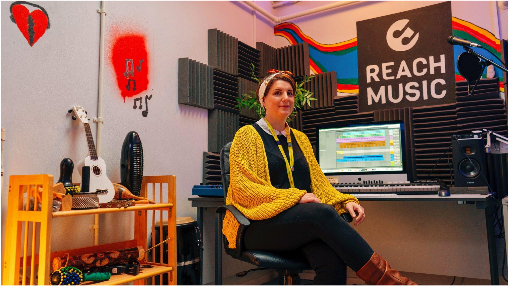 Barnardo's worker in the Reach music studio