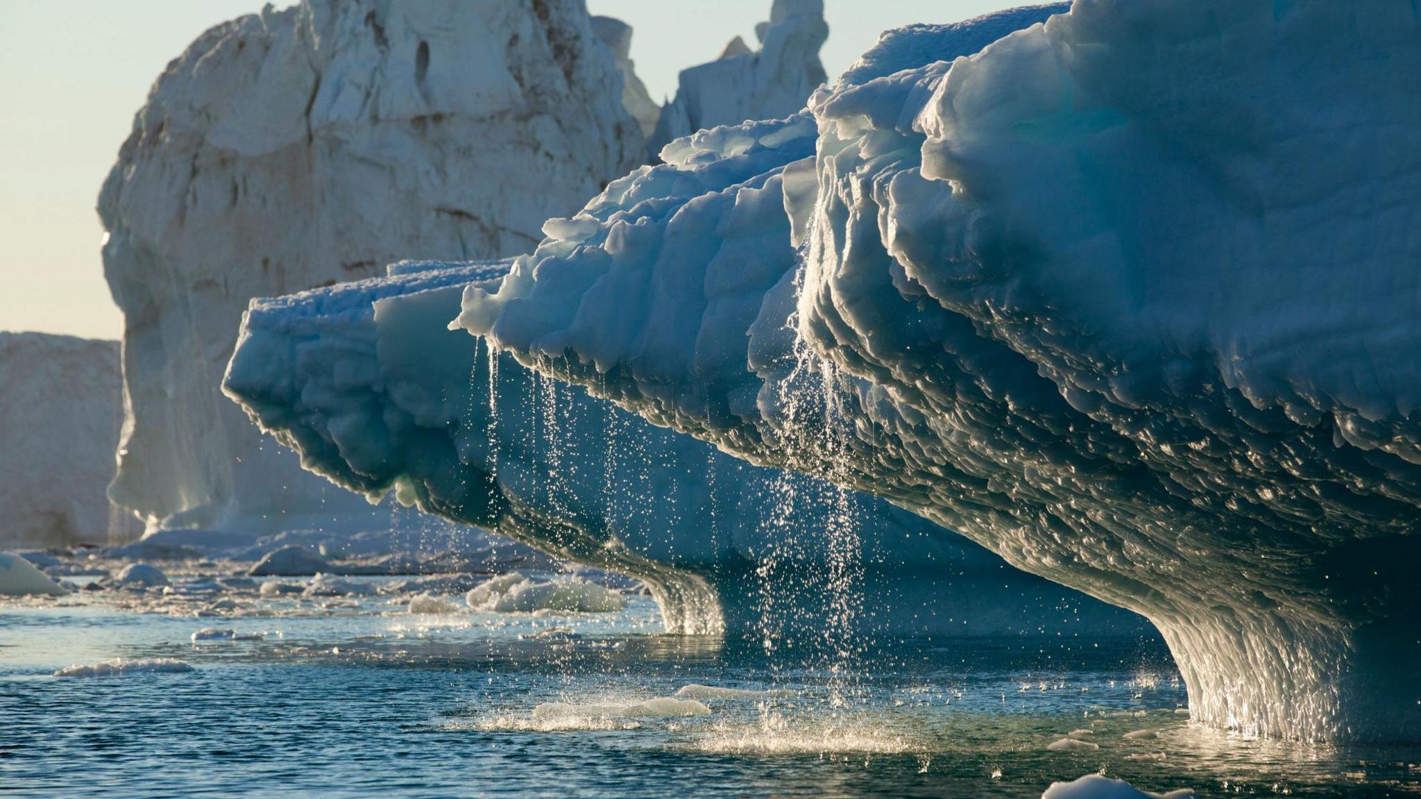 icebergs melting into the ocean