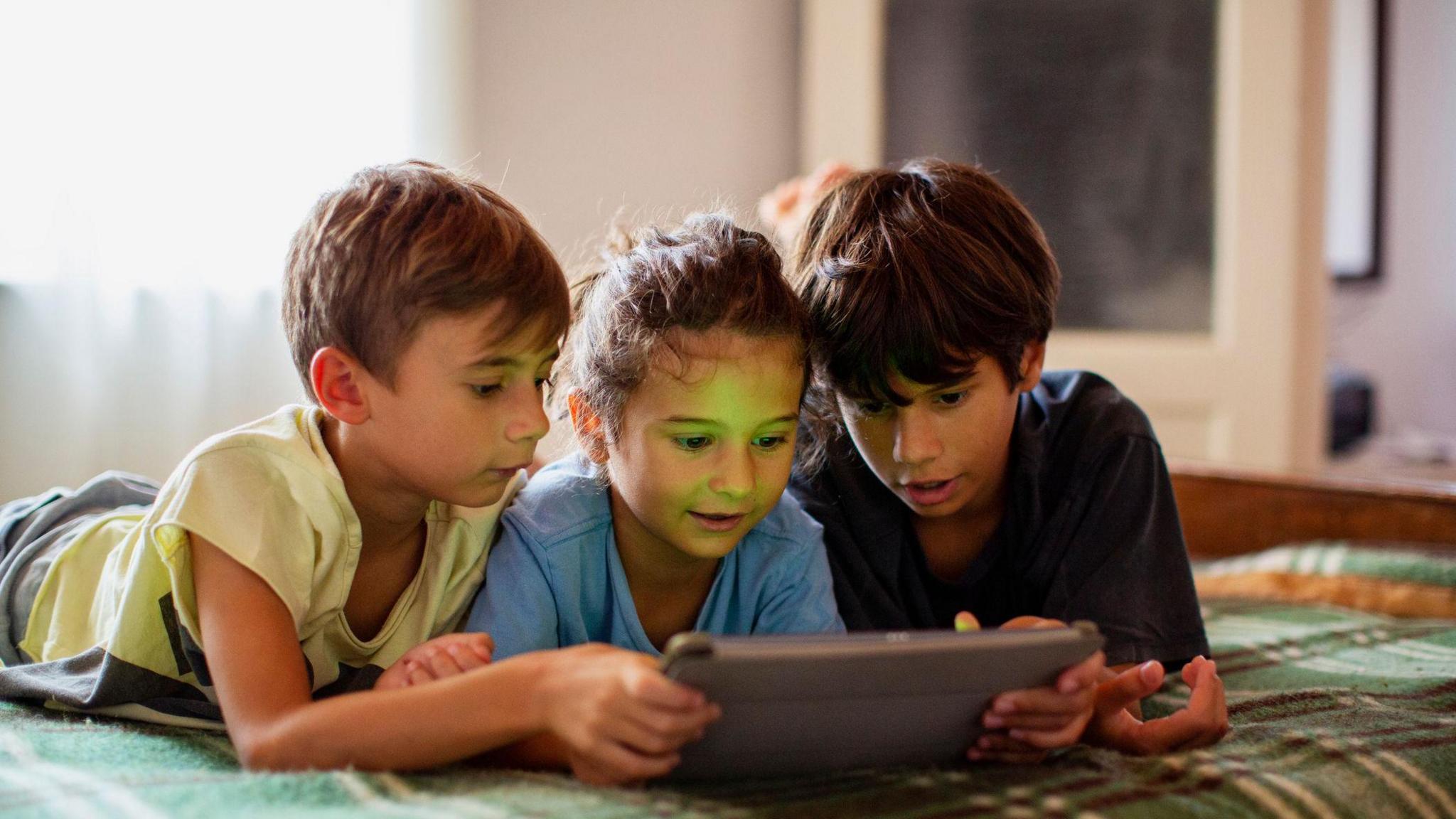 Children watching ipad
