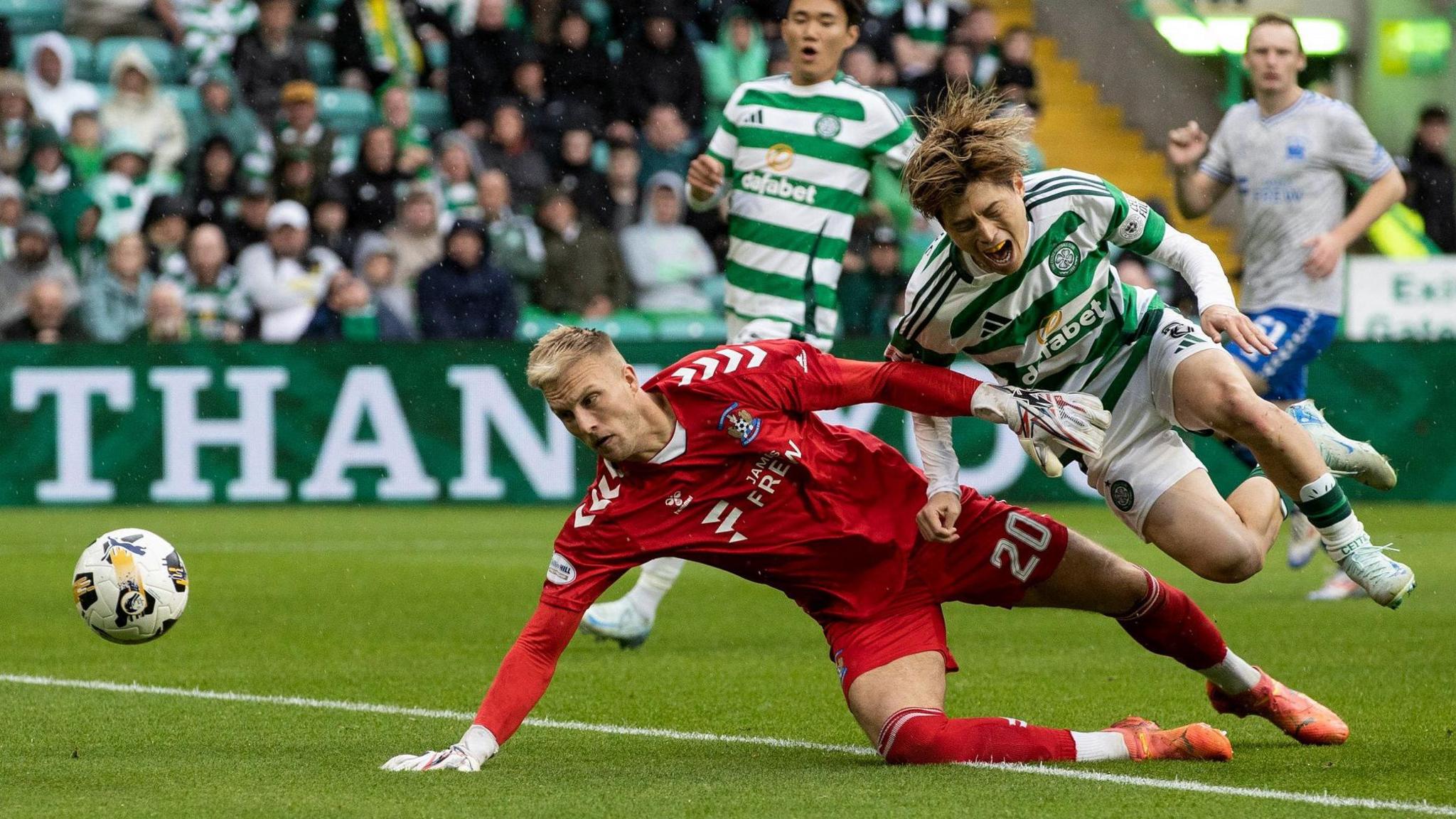 Kilmarnock goalkeeper Robby McCrorie challenges Celtic's Kyogo Furuhashi