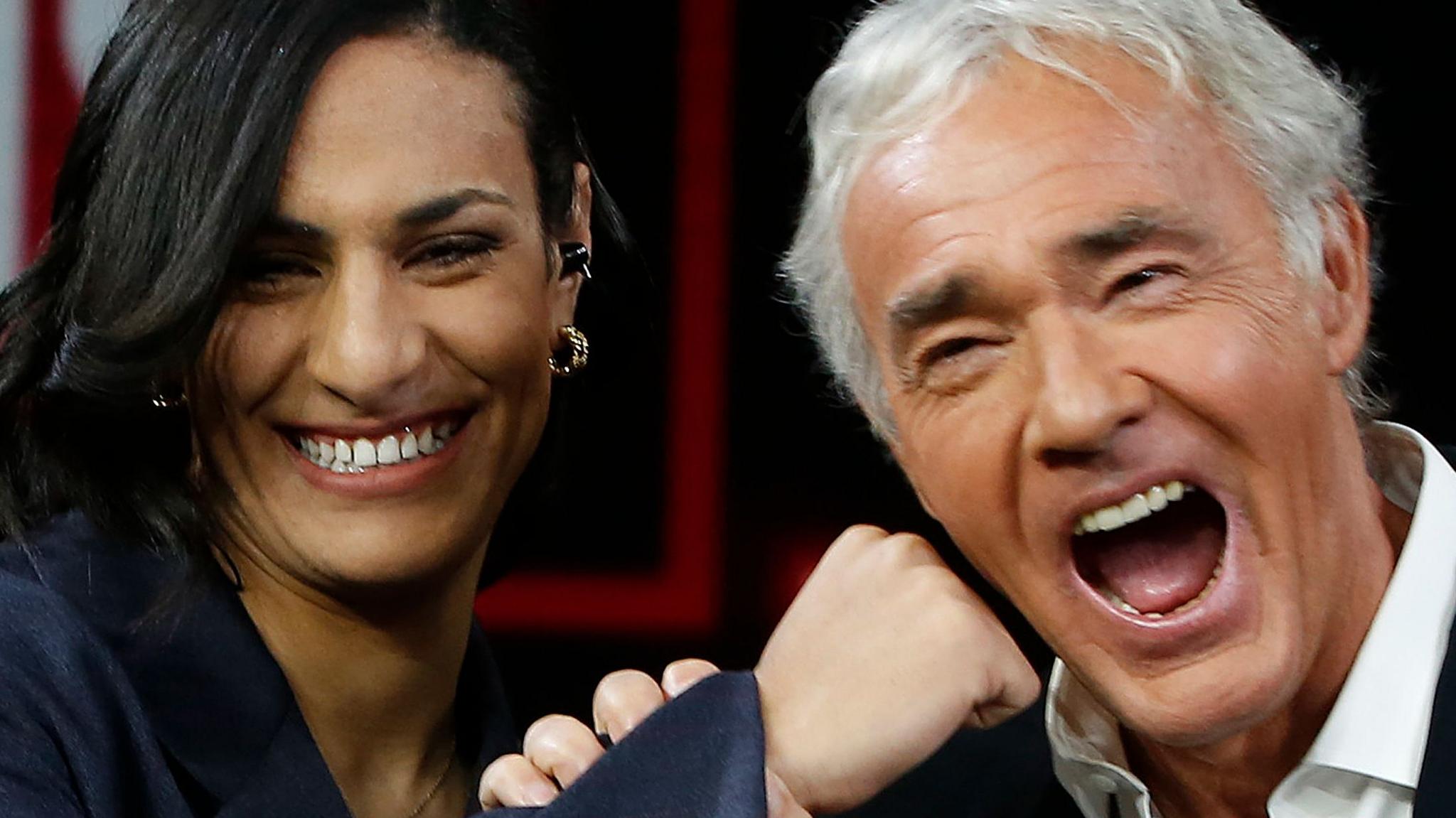 Algerian boxer Imane Khelif, winner of the gold medal at the Paris 2024 Olympic Games, attends the Raitre Italian TV show 'Lo stato delle Cose' (lit. the state of things), conducted by Italian presenter and journalist Massimo Giletti (R).