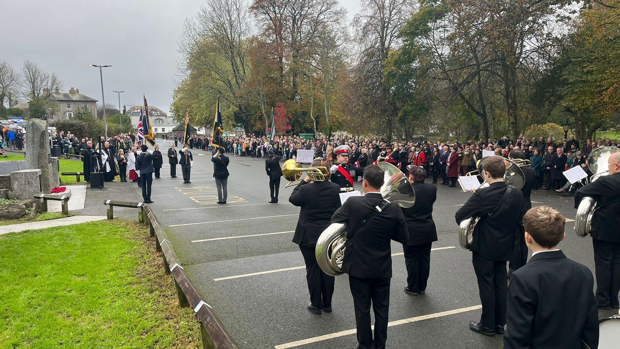 Remembrance Day service in Bodmin, with a military band in foreground, with dignitaries and members of the public in the background