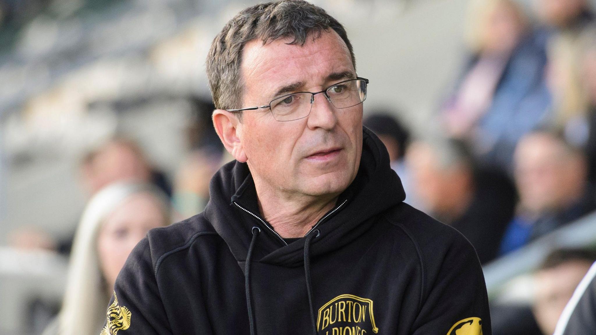 Gary Bowyer looks across to his bench while on the sideline for Burton Albion