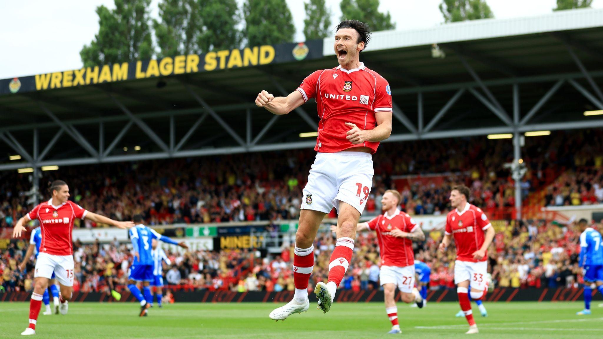 Wrexham's Kieffer Moore jumps in the air after scoring against Sheffield Wednesday