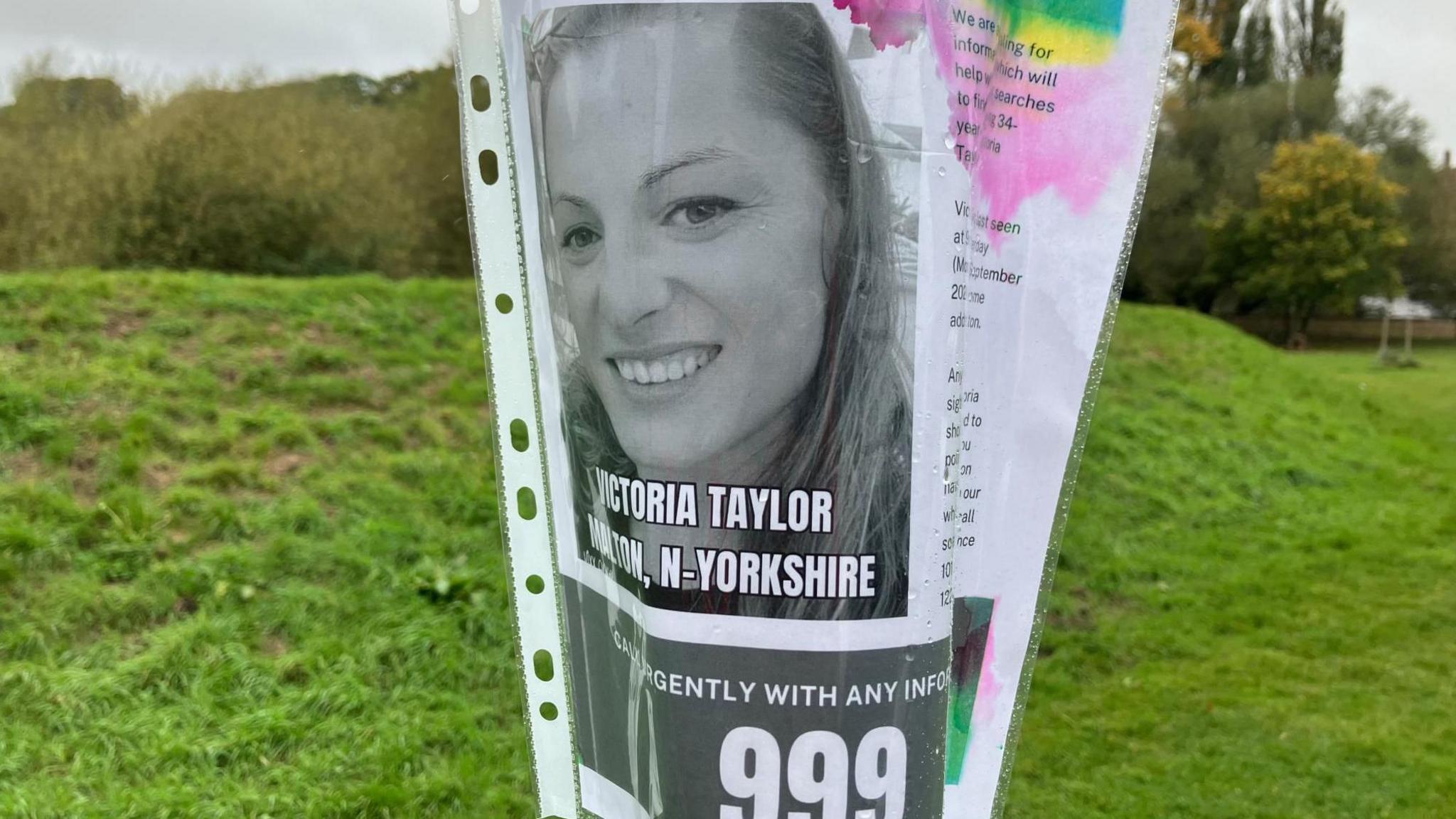 A poster, showing Victoria Taylor and the number 999, on a lamppost