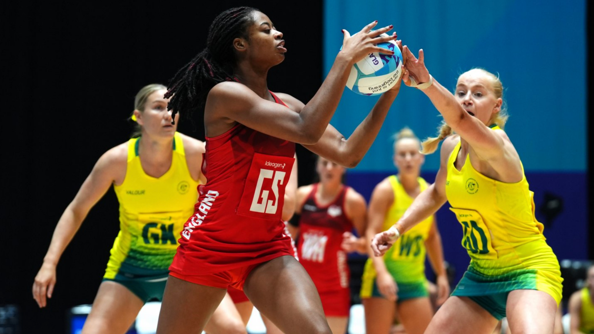 England's Liv Tchine tries to shield the ball from Australia in their bronze-medal match at the Commonwealth Games